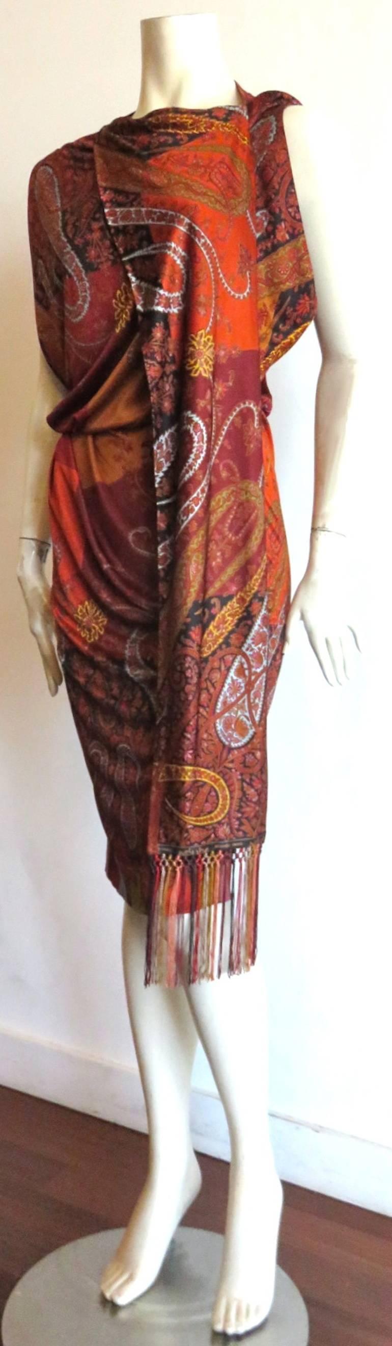 Never worn, HERMES PARIS by Jean-Paul Gaultier, Paisley printed stretch dress with fabulous, fringed, scarf detail front.

Loose fit, blouson-style top with elasticated waist, and draped bottom.

'HERMES PARIS' logo is printed at bottom border