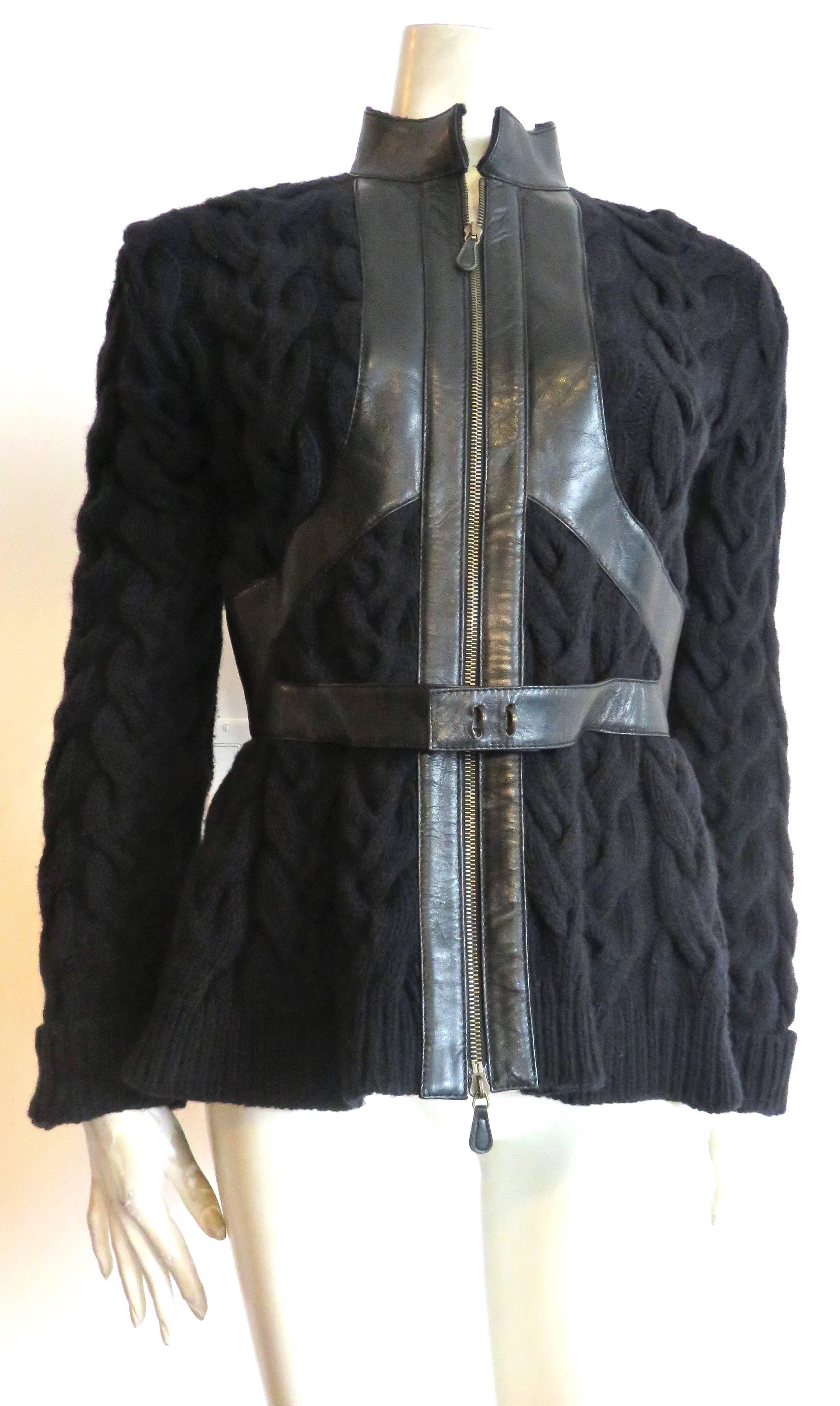 Pre-death, ALEXANDER McQUEEN, leather harness detail cable-knit sweater jacket.

This amazing, sweater jacket is made of pure, black, merino wool.  Thick, winter-weight, cable knit with attached, belted, leather harness design.  The back of the