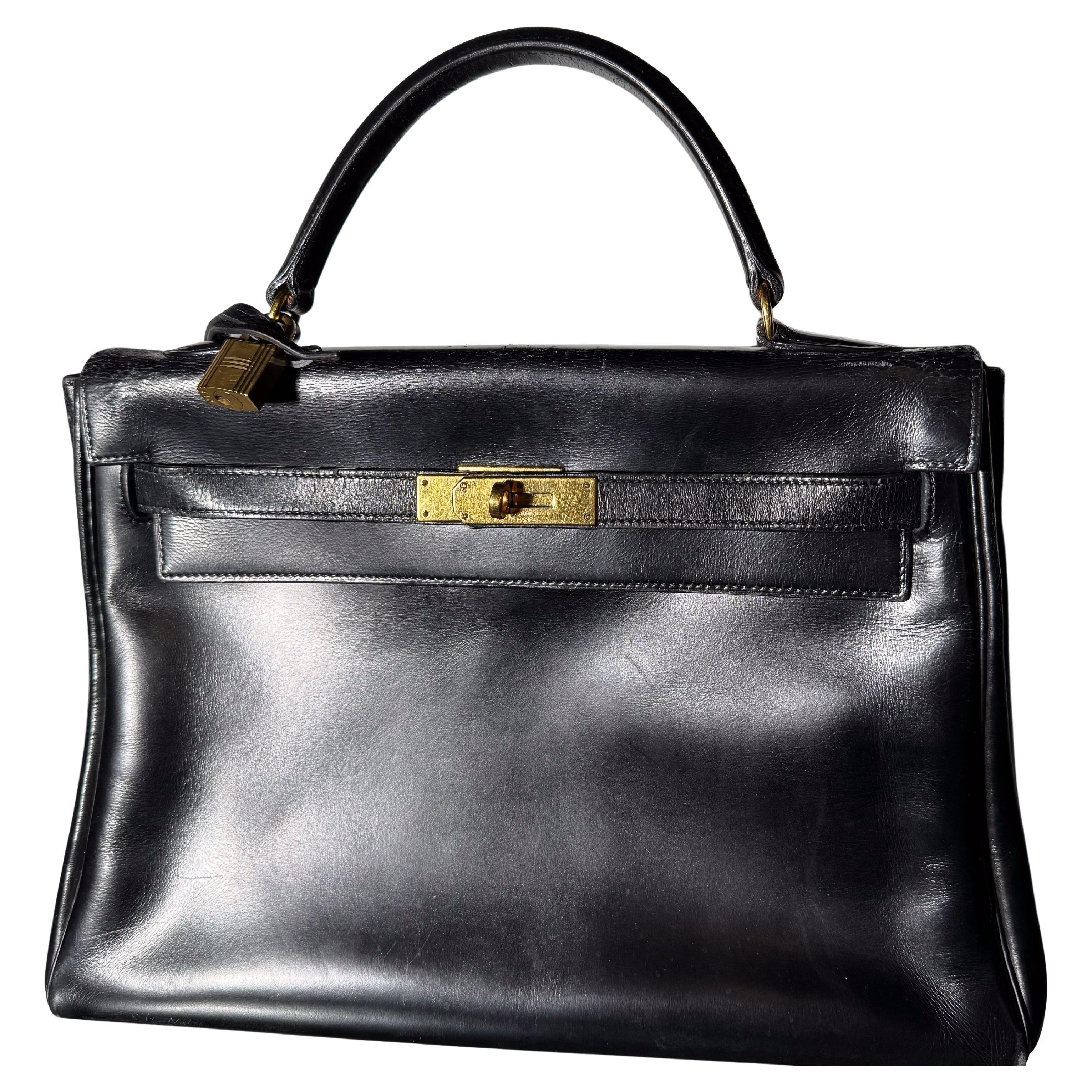 HERMÈS BLACK CALF BOX LEATHER RETOURNÉ KELLY 32 WITH GOLD PADLOCK and KEY, 1964 For Sale