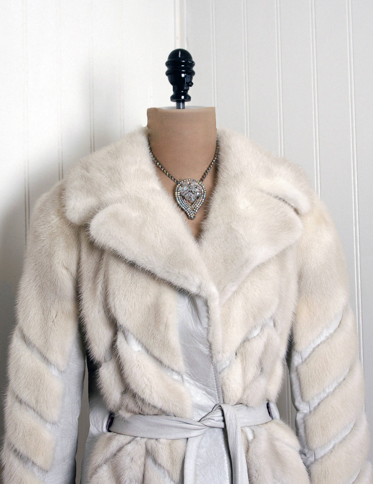 This exquisite 1960's genuine mink-fur and leather coat will make any woman shine during the cold winter months. The soft mink has been worked into an almost deco-stripes chevron pattern and the effect is really breathtaking. The care to piece this