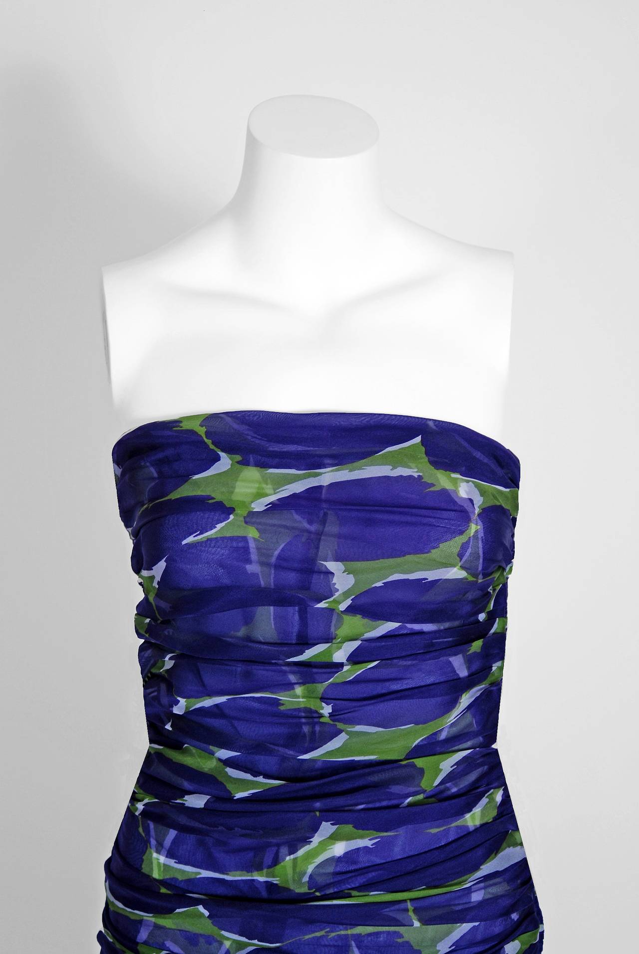 Breathtaking purple & green abstract print silk-organza gown from the infamous Rive Gauche collection of 1979. Pieces from this decade are very rare and are true examples of fashion history. I love the low-cut plunge, heavily-ruched strapless. The