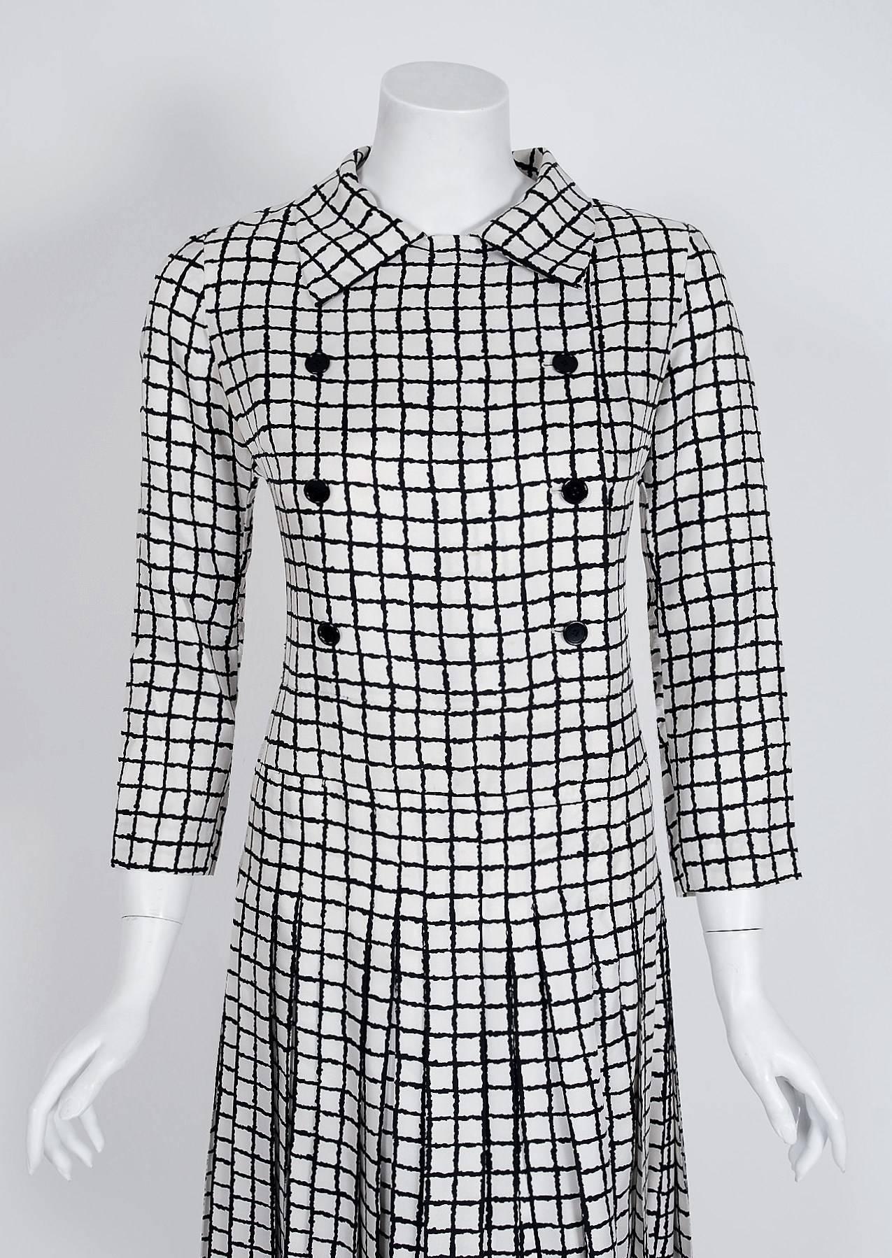 Breathtaking Yves Saint Laurent designer dress from his 1967 collection. Haute-Couture pieces from this decade are very rare and are true examples of fashion history. The fabric is a heavenly black and white checkered print silk. He then uses an