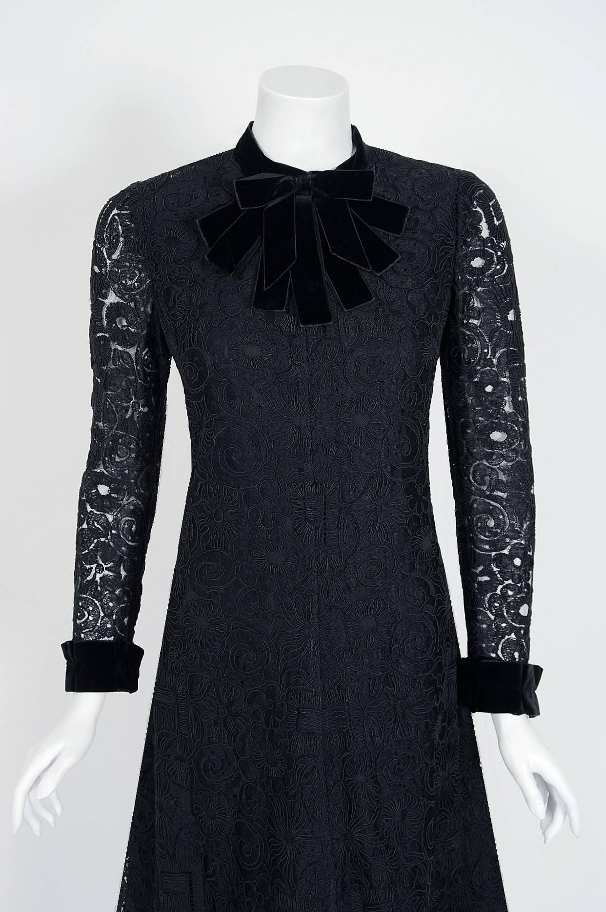 Breathtaking Yves Saint Laurent designer dress from his 1965 collection. Haute-Couture pieces from this decade are very rare and are true examples of fashion history. The fabric is a heavenly French black embroidered illusion Alencon net-lace. He