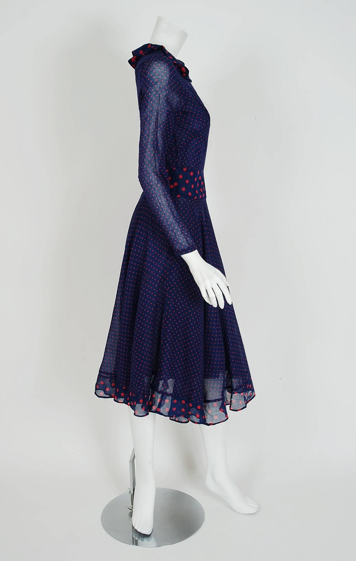 Gorgeous Thea Porter dress fashioned in navy and pink dotted print cotton voile. I love the beautiful color combination and clear nod to 1930's fashion. The silhouette is a flattering nipped waist tea-length with a flowing swing-skirt. I adore the