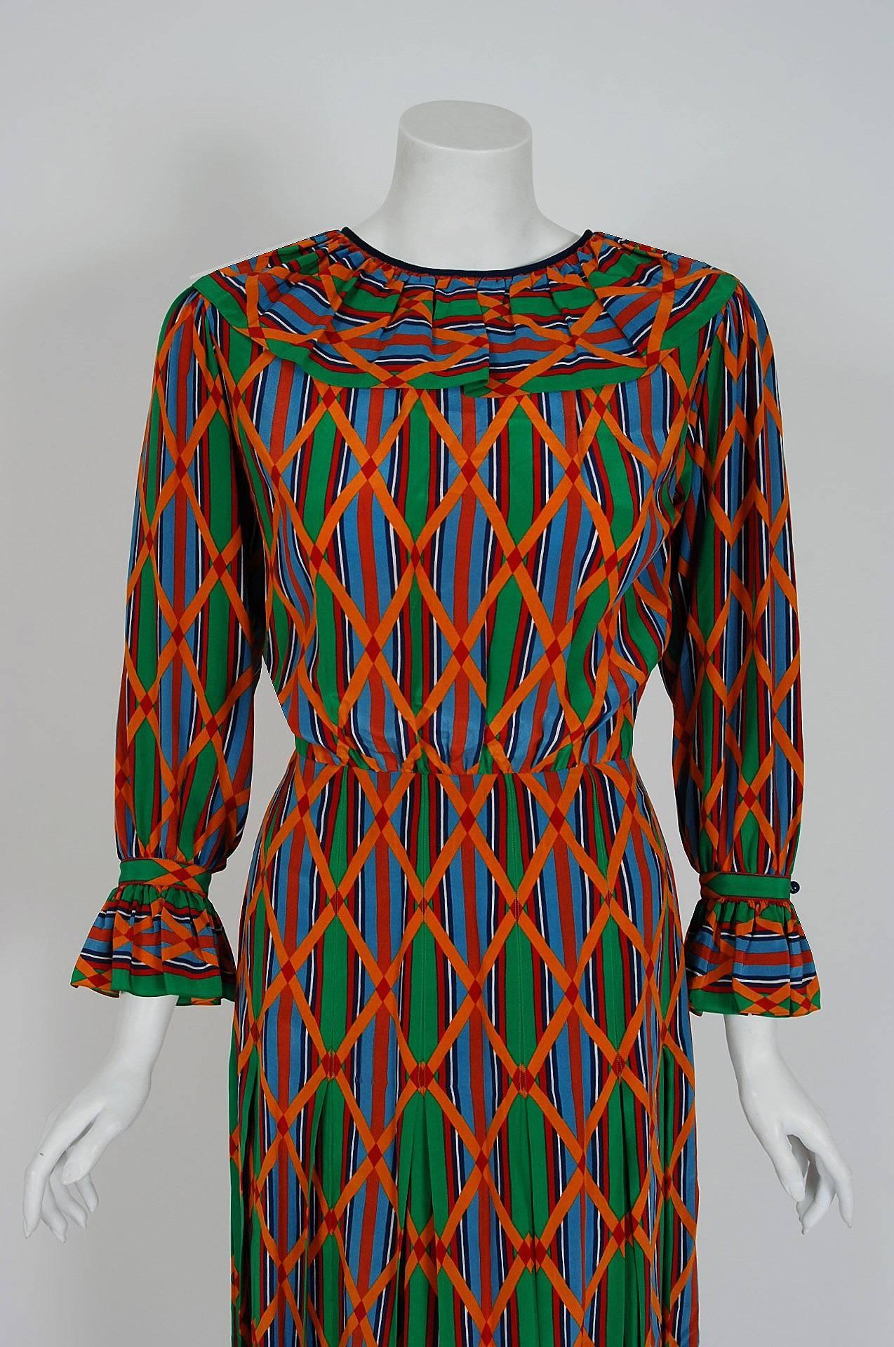 Breathtaking Yves Saint Laurent colorful Navajo southwestern print silk dress from the infamous Rive Gauche collection during the late 1970's. Pieces from this decade are very rare and are true examples of fashion history. The bodice has a beautiful