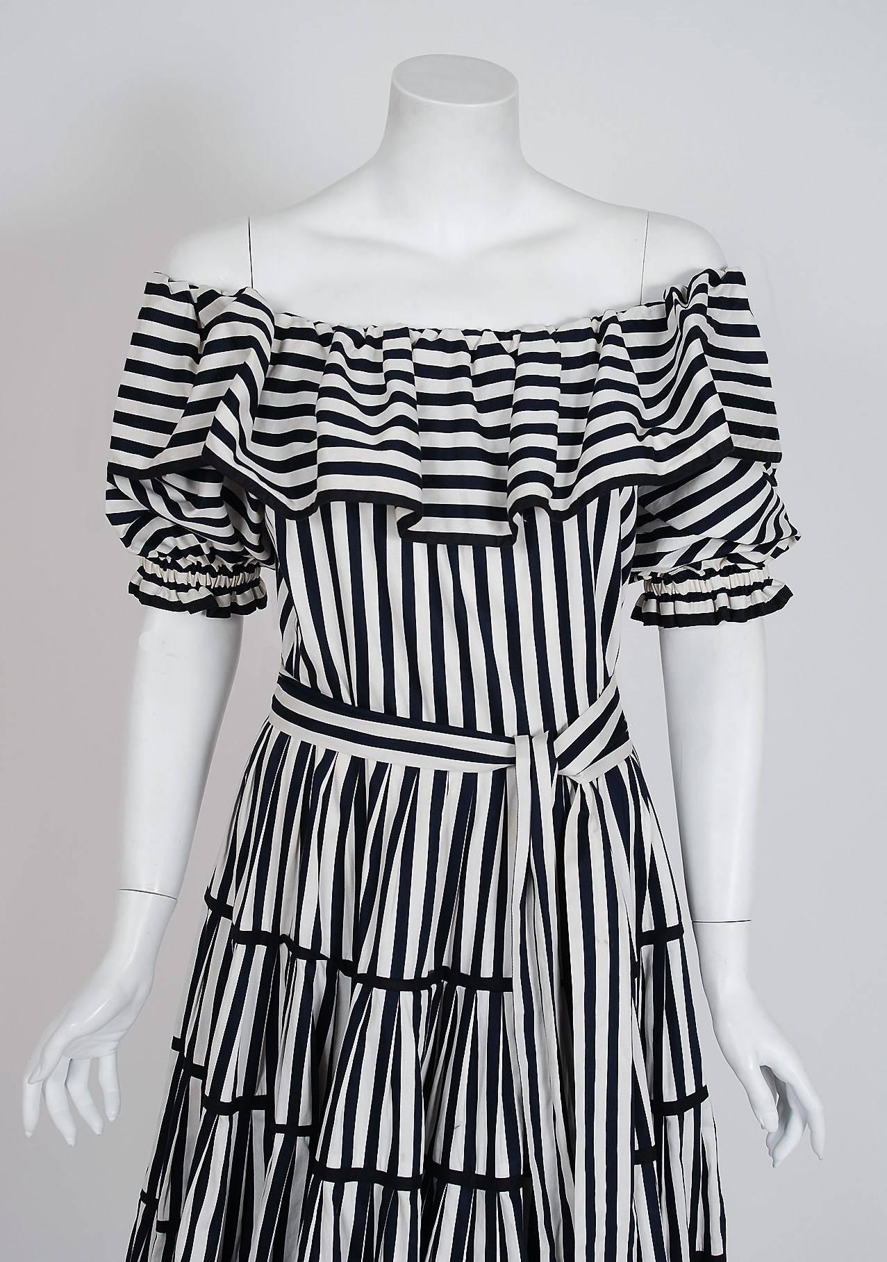 Breathtaking Yves Saint Laurent black and white striped cotton sundress from the infamous Rive Gauche collection during the mid-1970's. Pieces from this decade are very rare and are true examples of fashion history. I adore the low-cut plunge