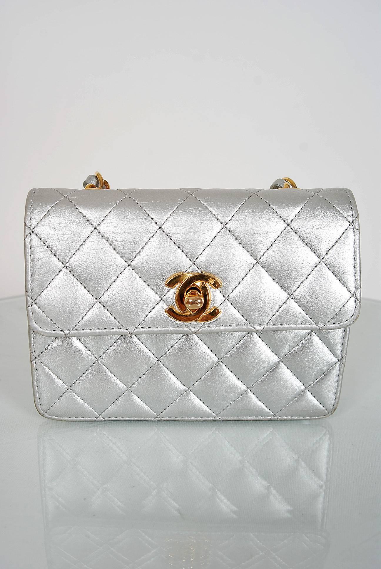 Chanel is known to be one of the most luxurious and decadent fashion houses in the world. This breathtaking metallic-silver purse is a perfect example of why this couture brand has stood the test of time. Quilted leather exterior trimmed with