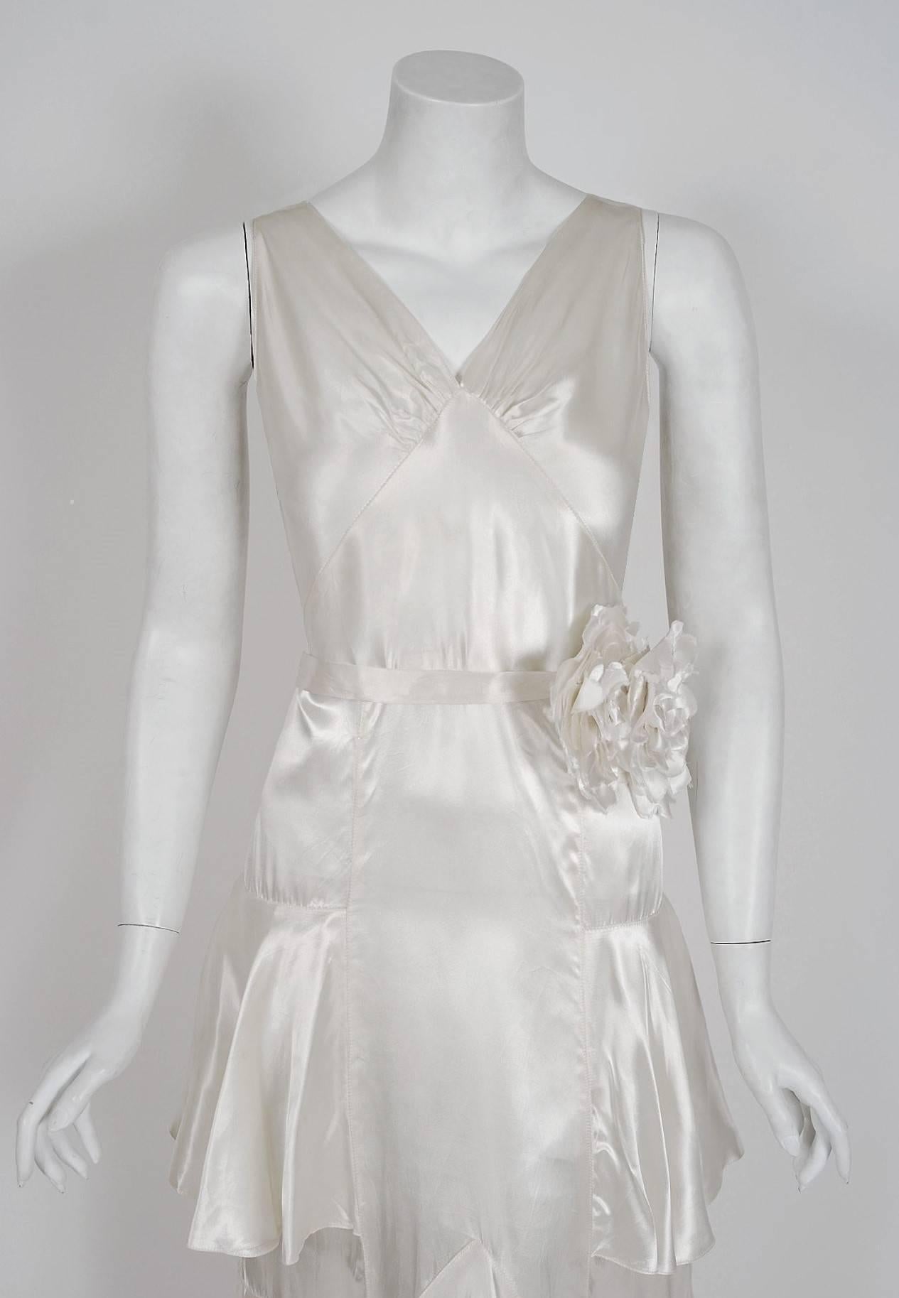 A stunning ivory white shimmer silk-satin gown from the 