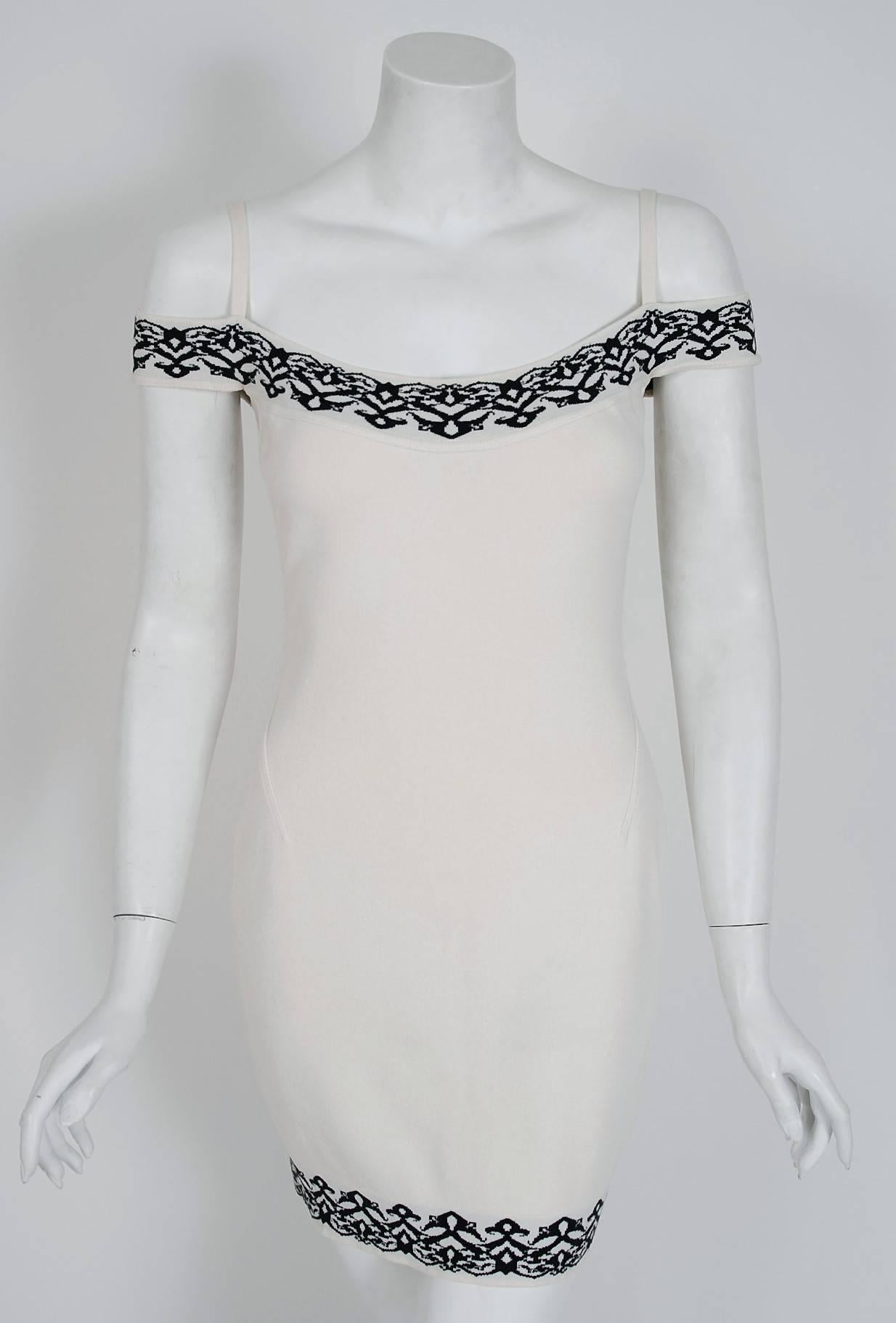 Iconic black and white patterned knit dress from Azzedine Alaia's 1992 Spring collection. In the 1980's when most of the fashion world was embracing sharp shouldered power dressing and baggy androgyny, Alaïa introduced the world to the 'body' and