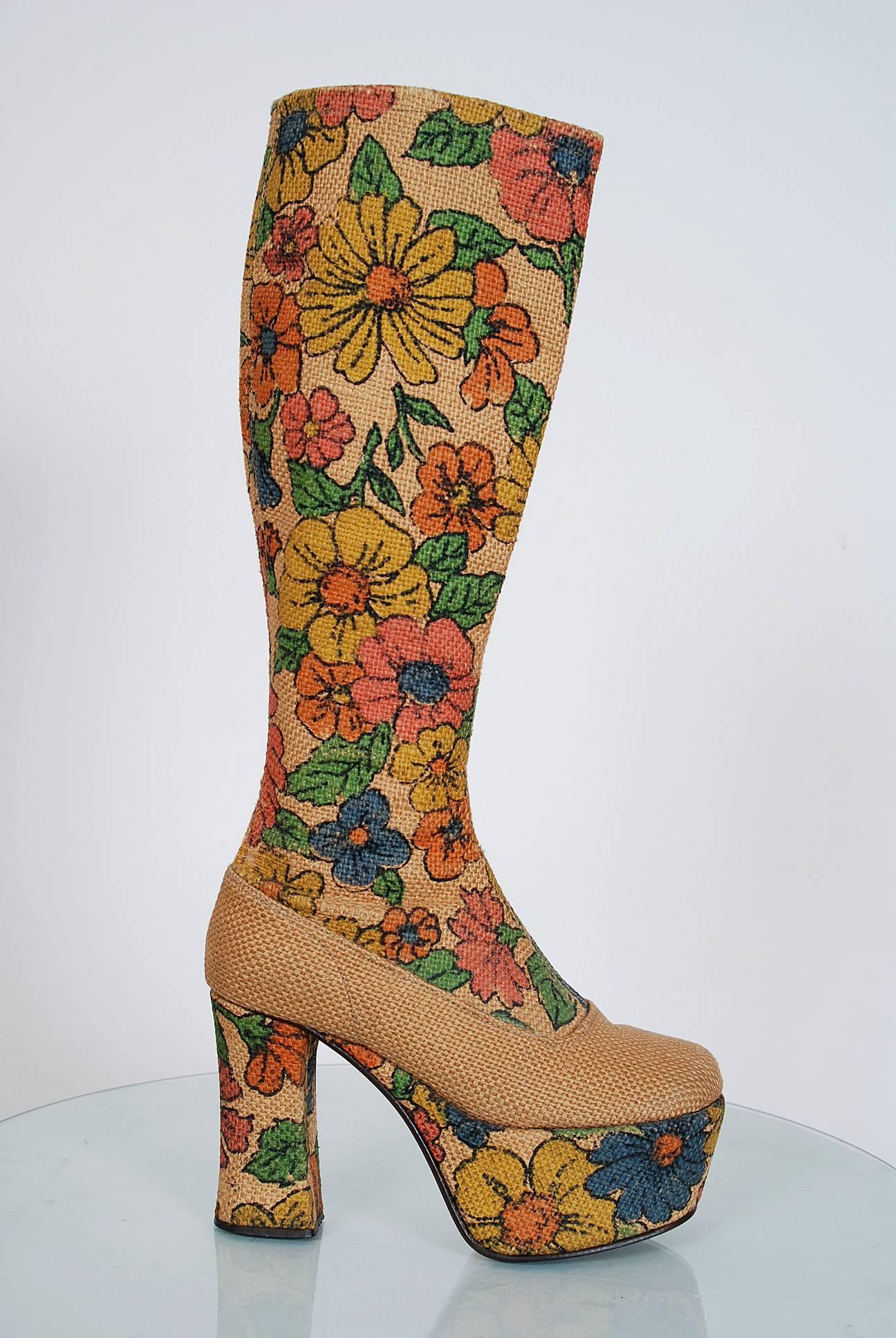 Amazing early 1970's American designer barkcloth boots in the most incredible floral-garden pattern! These boots have unbelievable stacked wood-platforms with handcrafted work throughout. I love the shaped heel and seductive knee-high design. Boots