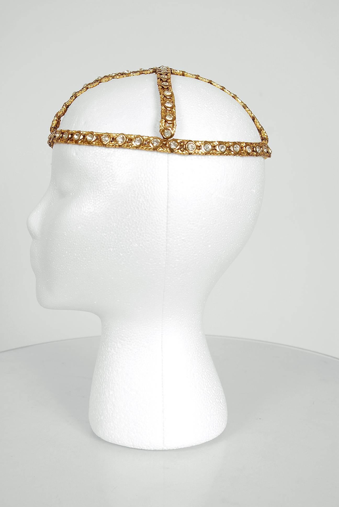 Opulent 1920's French metallic-gold brass and rhinestone flapper evening headpiece. This is, without a doubt, one of the most extraordinary antique Juliet caps I have ever laid eyes on. Prong-set rhinestones with tons of sparkle on gorgeous