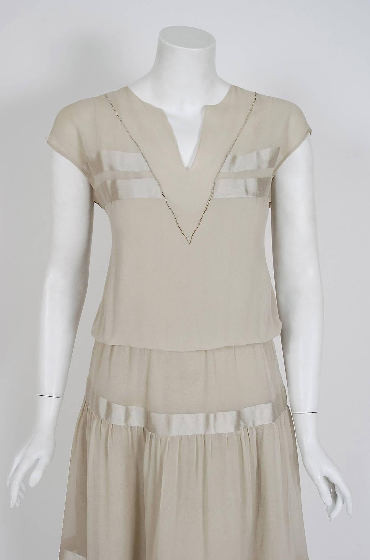 An ethereal and breathtaking 1970's Karl Lagerfeld for Chloe silk-chiffon peasant dress. He uses an ingenious silk-charmeuse striped technique which really gives the garment so much depth and texture. I really love the grey-putty color used which