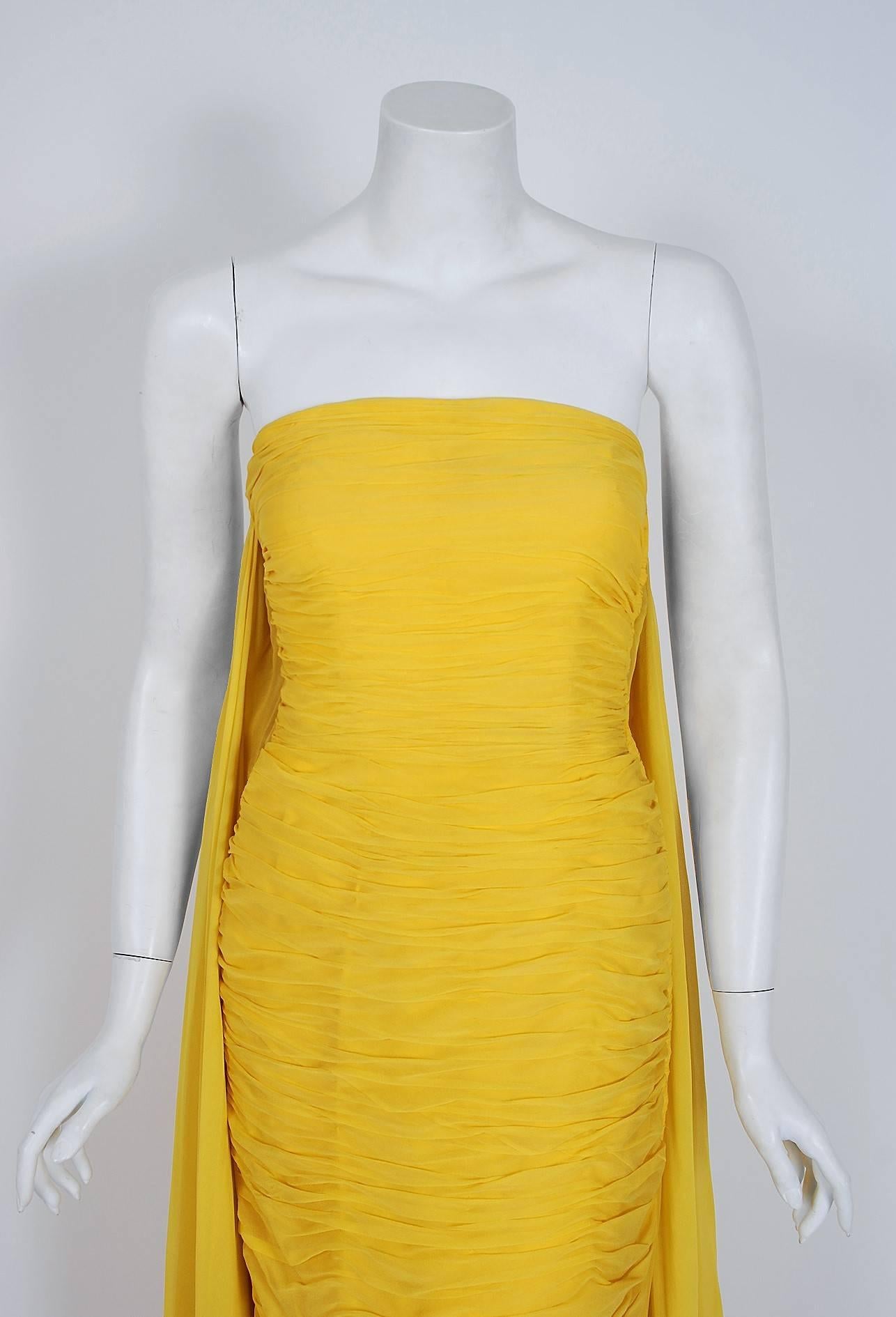 Breathtaking late 1950's Luis Estévez vibrant yellow ruched goddess gown in a rich silk-chiffon. Starting out at Patou in Paris, Estévez went on to design under his own name to great acclaim in 1955. He was considered one of the brilliant young