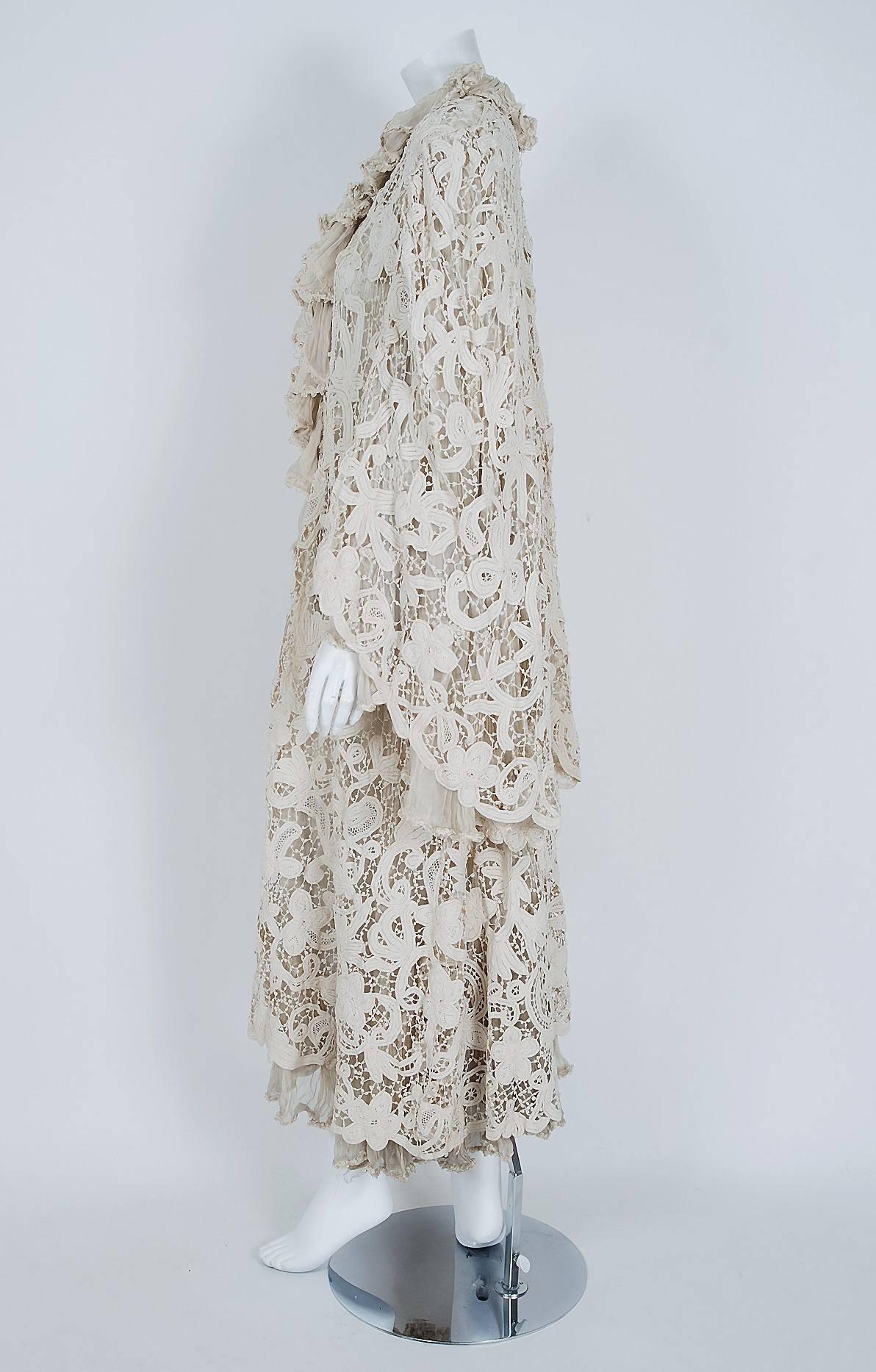 This sensational custom-made Edwardian couture coat, dating back to 1906, is lavishly fashioned with vining floral patterned Battenburg lace. The highly stylized handwork perfectly captures the Art Nouveau aesthetic. Ethereal ivory-white is the base