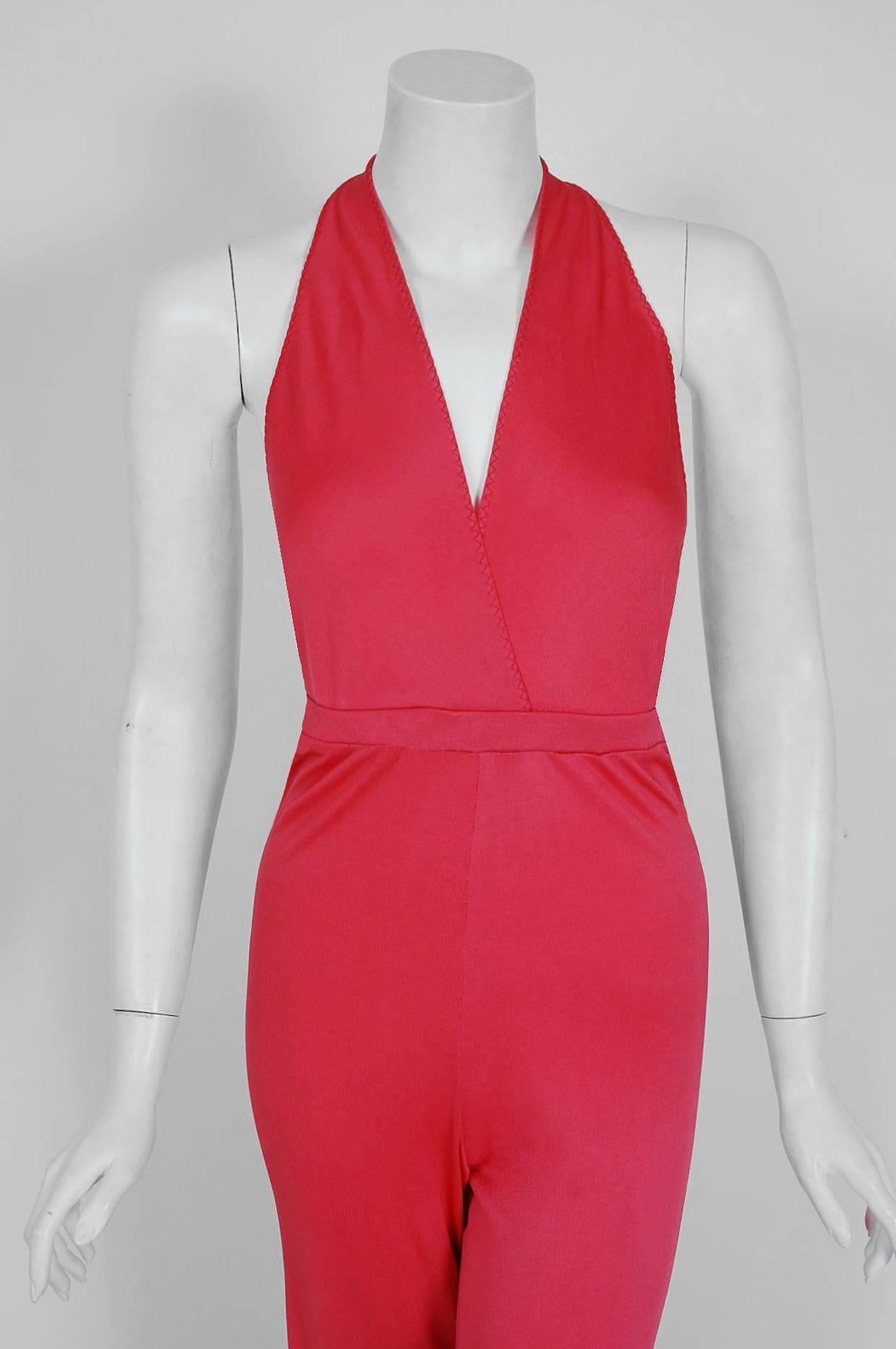 Ultra seductive 1970's bubblegum-pink jumpsuit by the famous Stephen Burrows. Melding his training in classic technique with his own adventurous vision, he is best known for his 