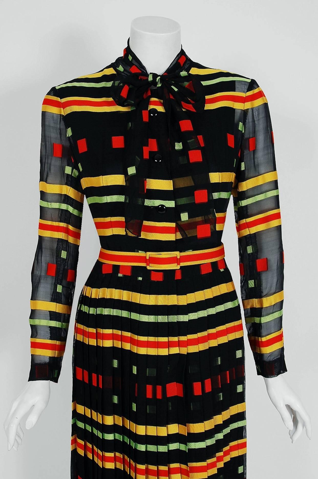 Givenchy, the name itself evokes glamour, refined elegance, simplicity and style. Givenchy's trademark of flowing lines and print fabrics make his work easily recognizable. This gorgeous multi-colored striped and deco-dot print illusion silk dress,