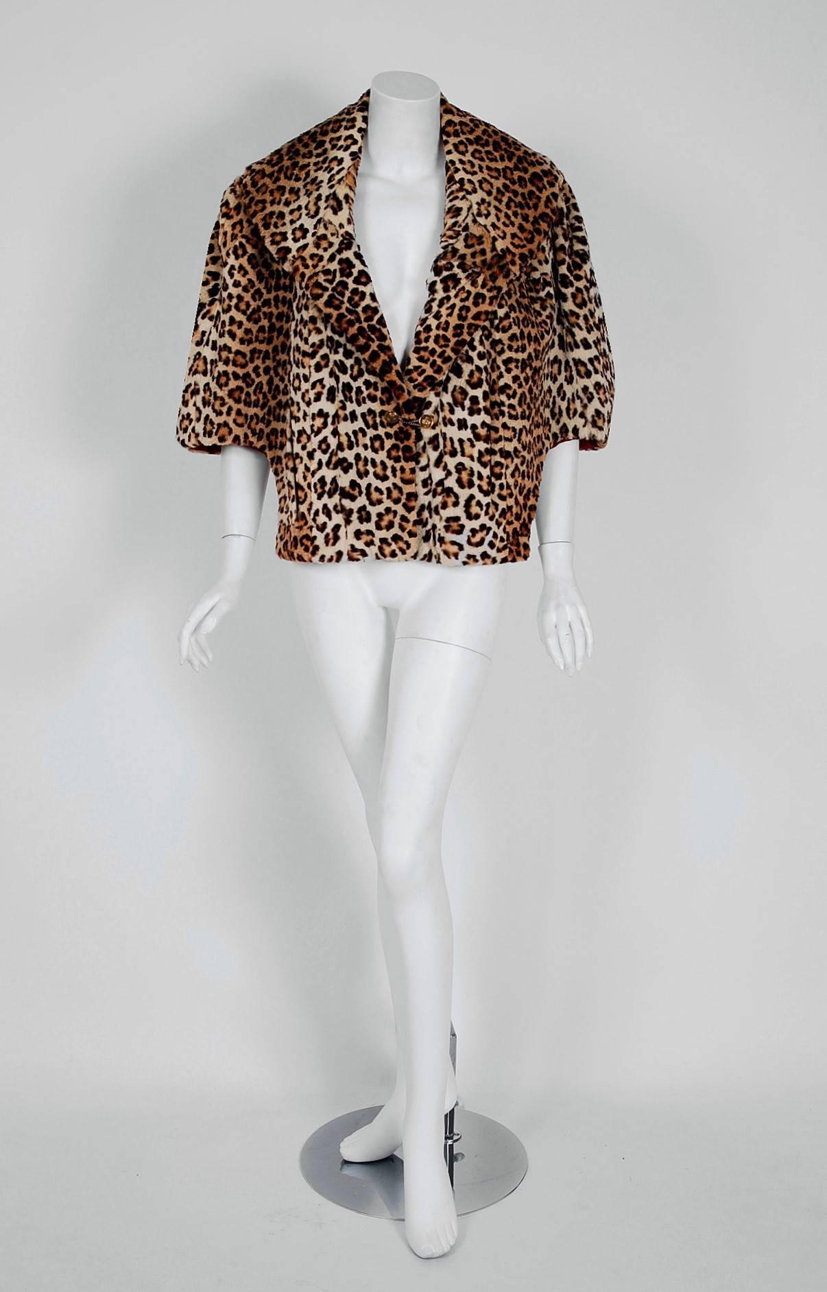 This exquisite early 1950's genuine leopard-print mouton fur cape by New York designer "I.R Fox" will make any woman shine during the upcoming cold winter months. The soft fur has been dyed to resemble a perfect leopard pattern and the