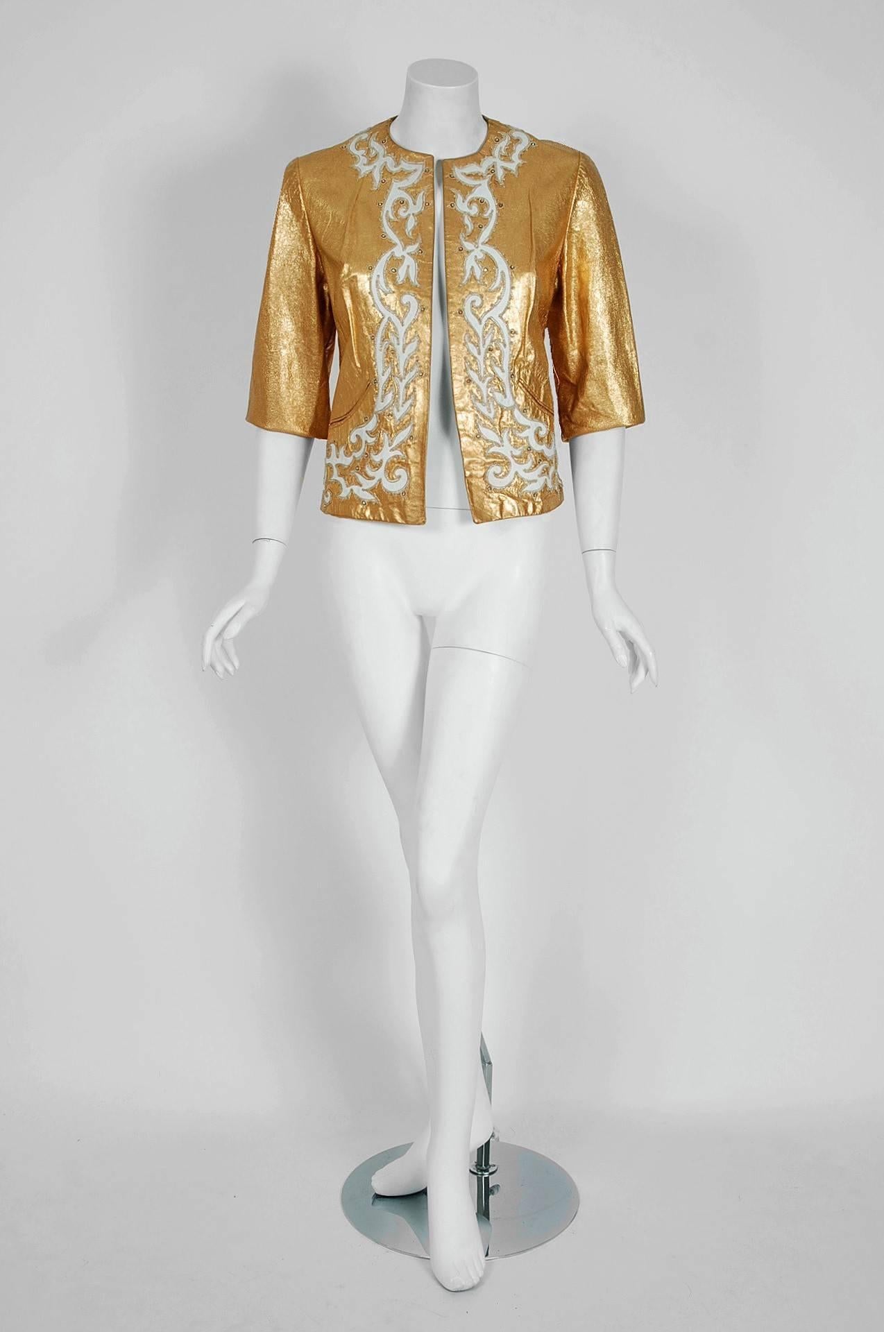 Spectacular metallic-gold cropped jacket by California designer Jacques Suedes. This rare and exquisite ladies rhinestone studded and embroidered leather jacket is the pinnacle holy grail garment for anyone bent on collecting those 