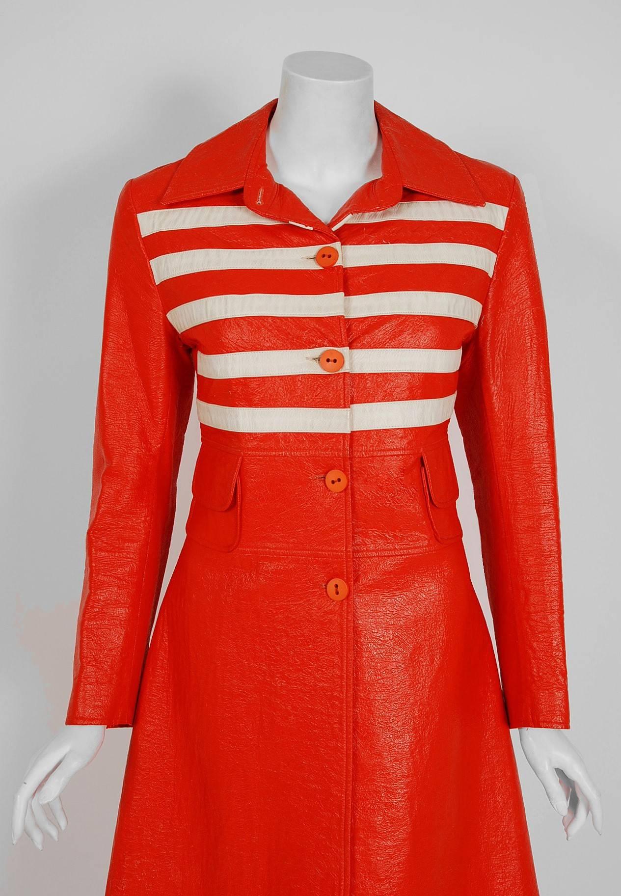 Breathtaking Louis Feraud orange & white striped vinyl trench coat from his 1968 collection. Feraud's career started when he opened his first French boutique in 1955. As luck would have it, Brigitte Bardot bought one of his dresses and the attention