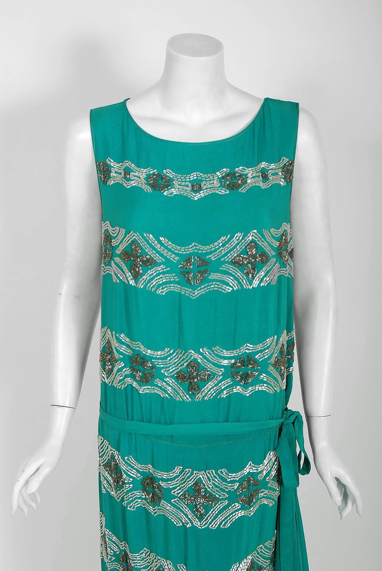 Vibrant flapper dresses from the early 20th century are perennial favorites and this one is a show-stopper. So Great Gatsby! The garment's simple unstructured style is so modern; the fine beadwork is a treasure trove of needle art. This beauty,