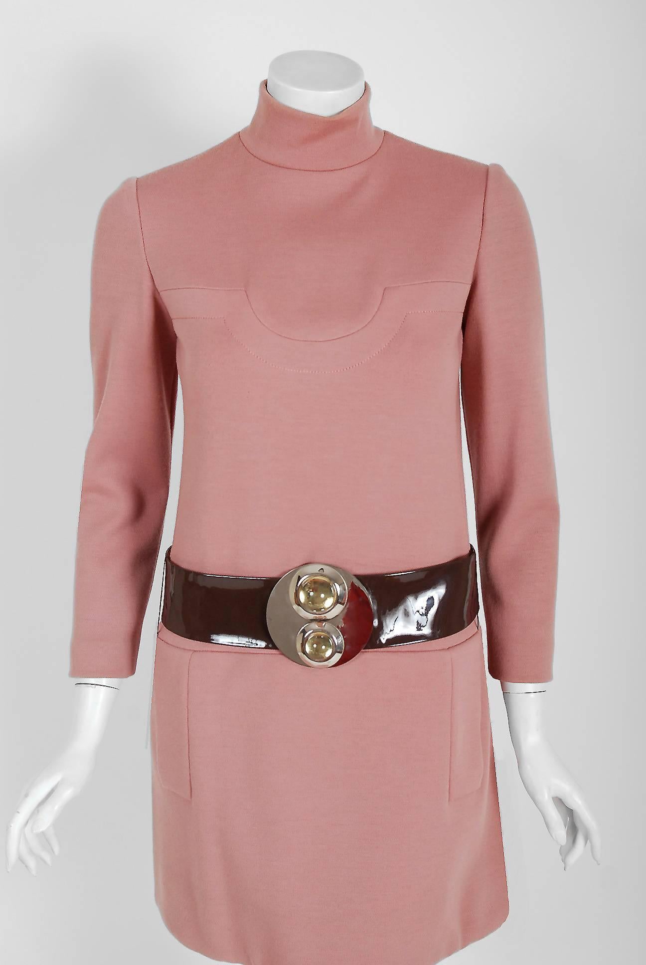 Spectacular Pierre Cardin mauve-pink wool mod dress from his 1967 fall/winter collection. In 1951 Cardin opened his own couture house and by 1957, he started a ready-to-wear line; a bold move for a French couturier at the time. The look most