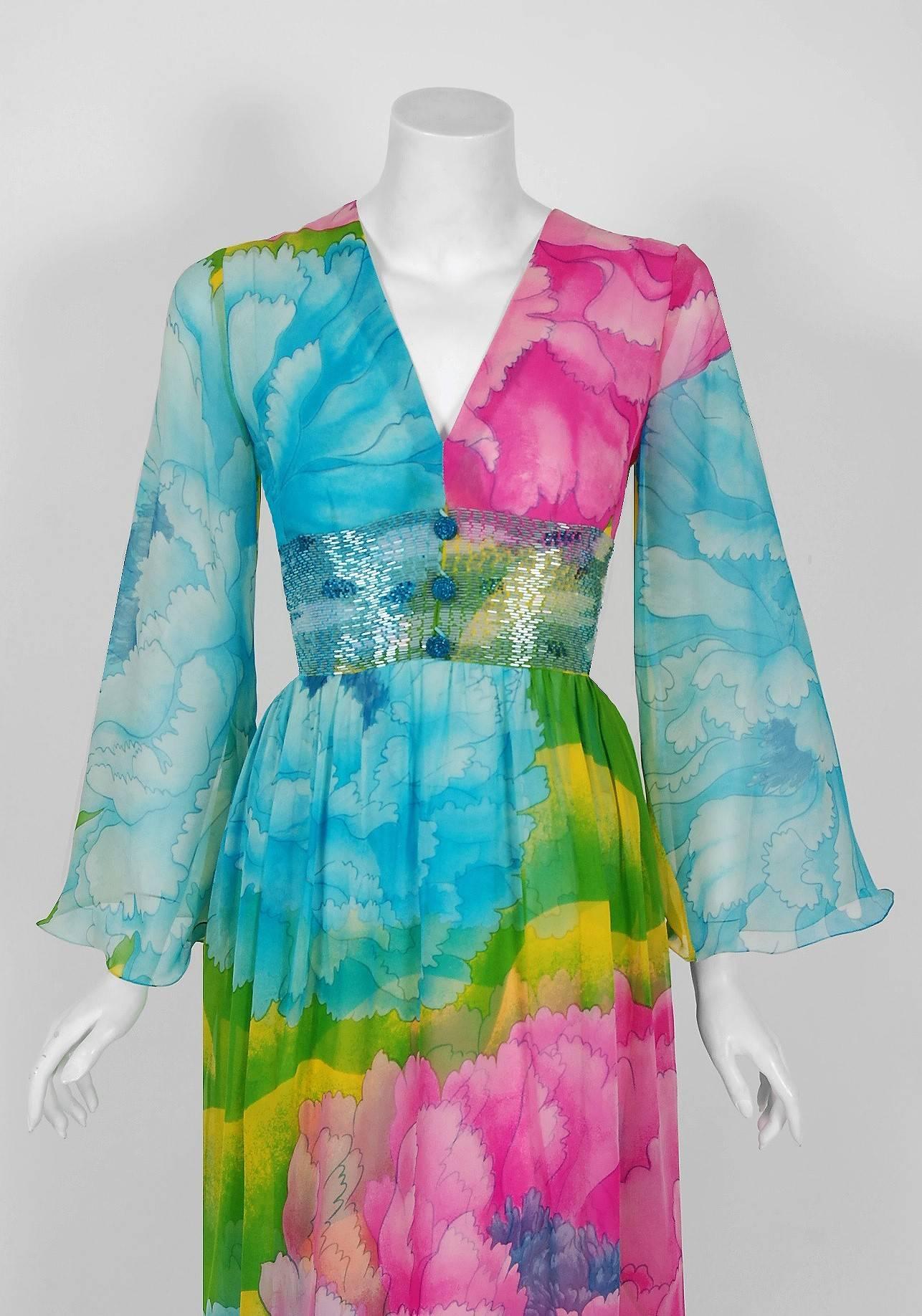 Breathtaking 1972 museum quality large scale floral print silk-chiffon dress by Hanae Mori. Whilst on a Paris holiday in 1960, Mori had a fateful fitting with Coco Chanel. She claimed this meeting changed her life and she challenged herself to