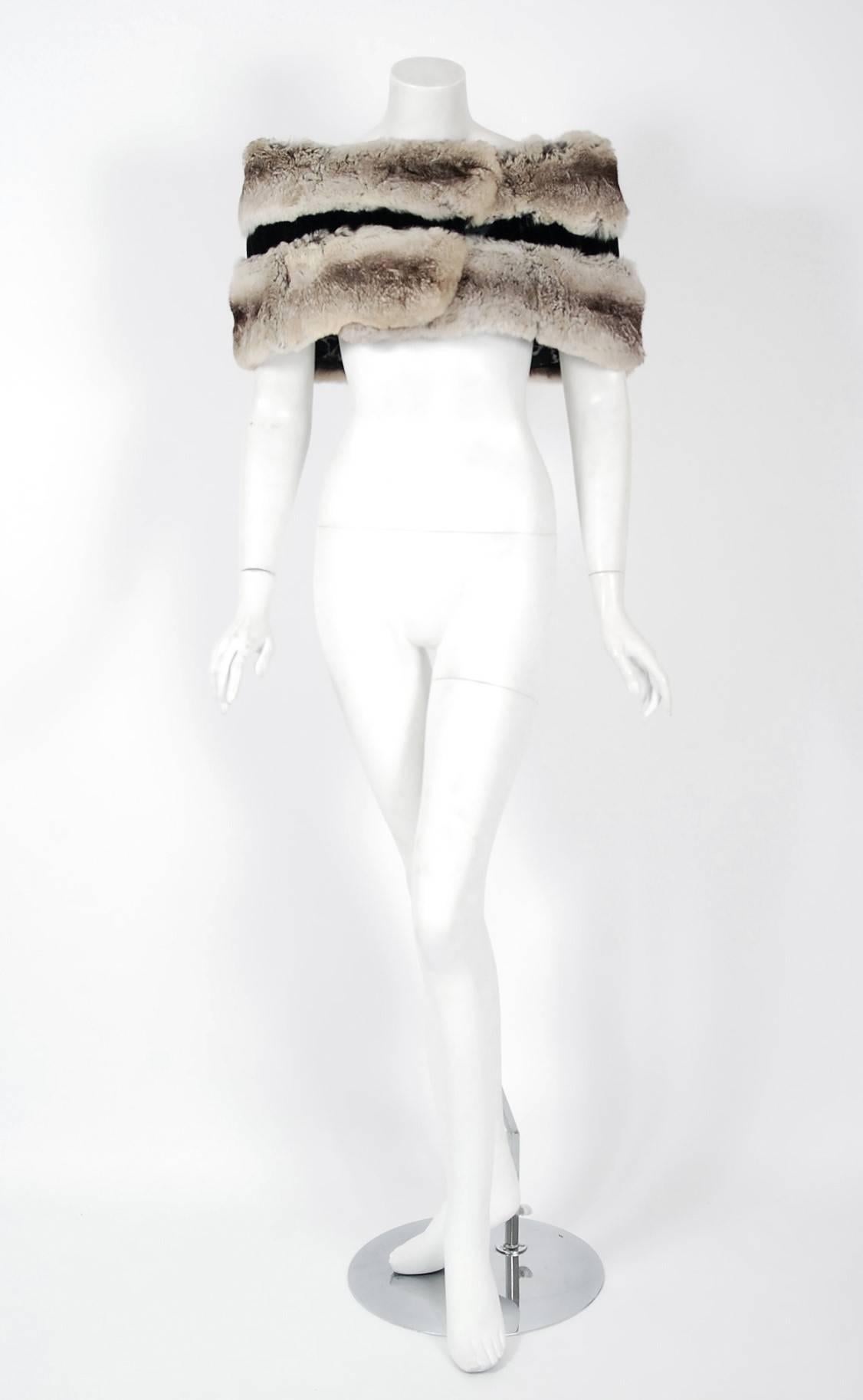 An extraordinary genuine chinchilla-fur and velvet stole from the Florida couture boutique "Rosengarten". It is easy to see the level of quality in this piece; the fur is extremely supple and soft. The garment is pieced together in