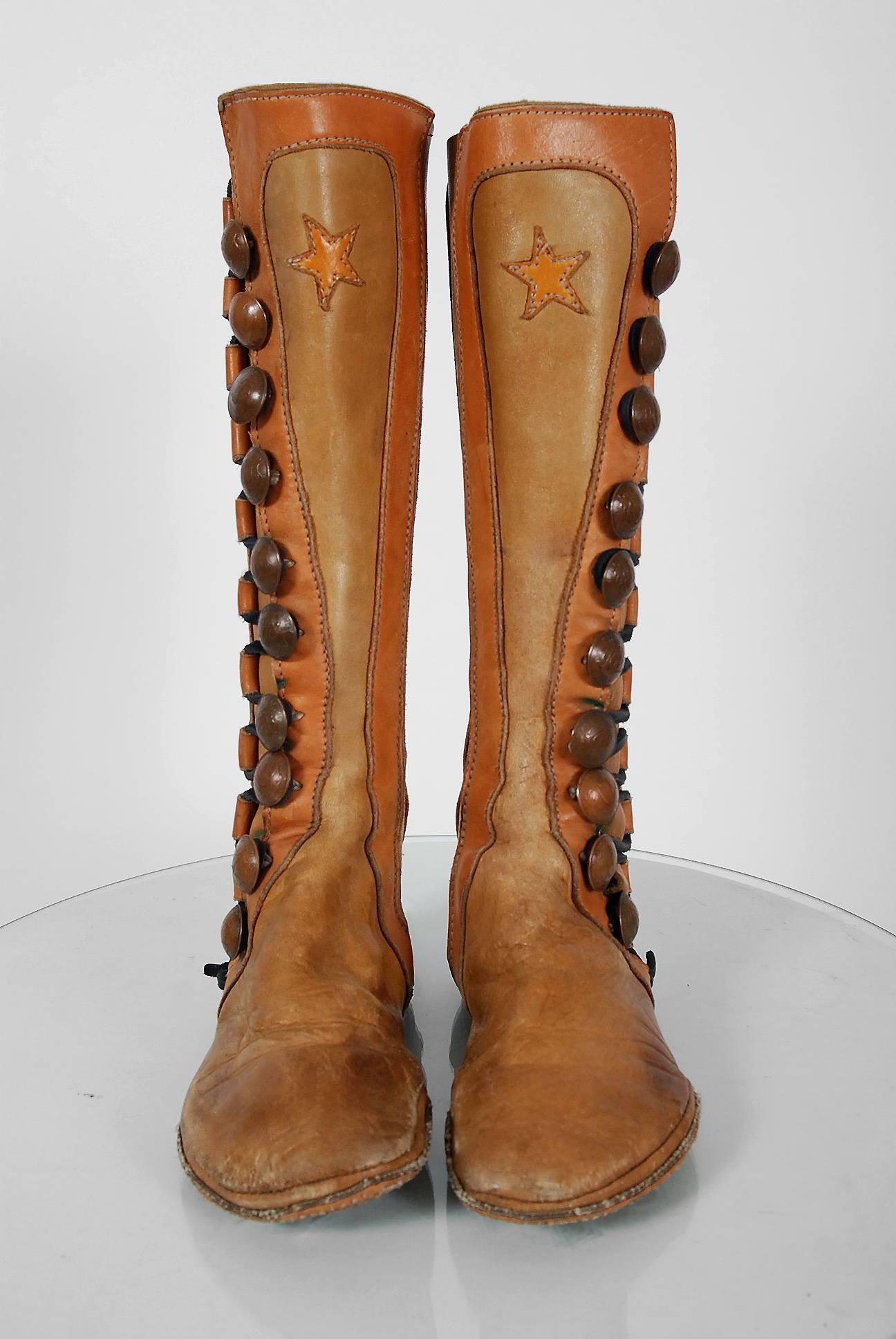 Sensational 1960's handmade bohemian flat moccasin boots in the most amazing knee-high style! The leather used is an ultra-soft buffalo hide in complementary brown hues. I love the genuine buffalo nickel buttons and unique star-novelty applique