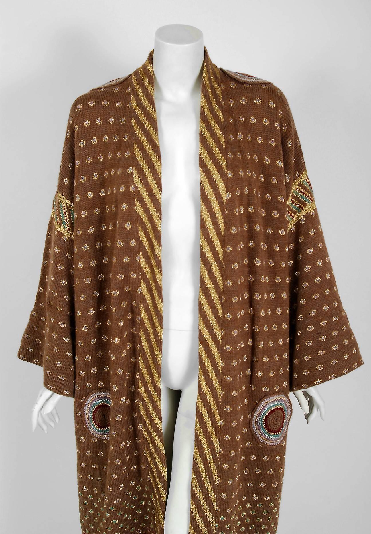 Timeless Vixen is excited to offer this breathtaking 1974 Bill Gibbs museum quality colorful hand-knit kimono sweater jacket. Bill Gibbs, the British iconic designer of the 1970's, drew his patterns on paper and with the knit wear guru Keffe Fassett