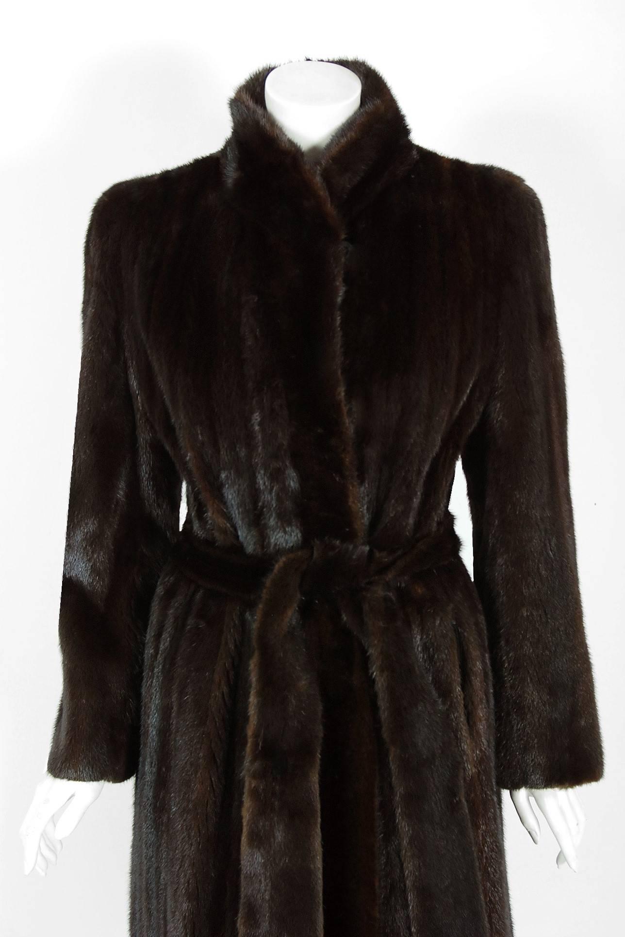 This luxurious 1970's Bill Blass Couture genuine ranch-mink princess coat will make any woman shine during cold winter months. The soft mink been worked into clean vertical panels and the effect is really breathtaking. The care to piece this