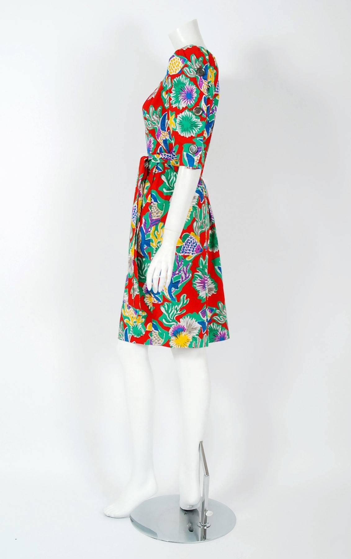 Breathtaking Yves Saint Laurent colorful novelty tropical fish-print cotton dress from the infamous spring/summer 1981 Rive Gauche collection. Pieces from this decade are very rare and are true examples of fashion history. The bodice has a gorgeous