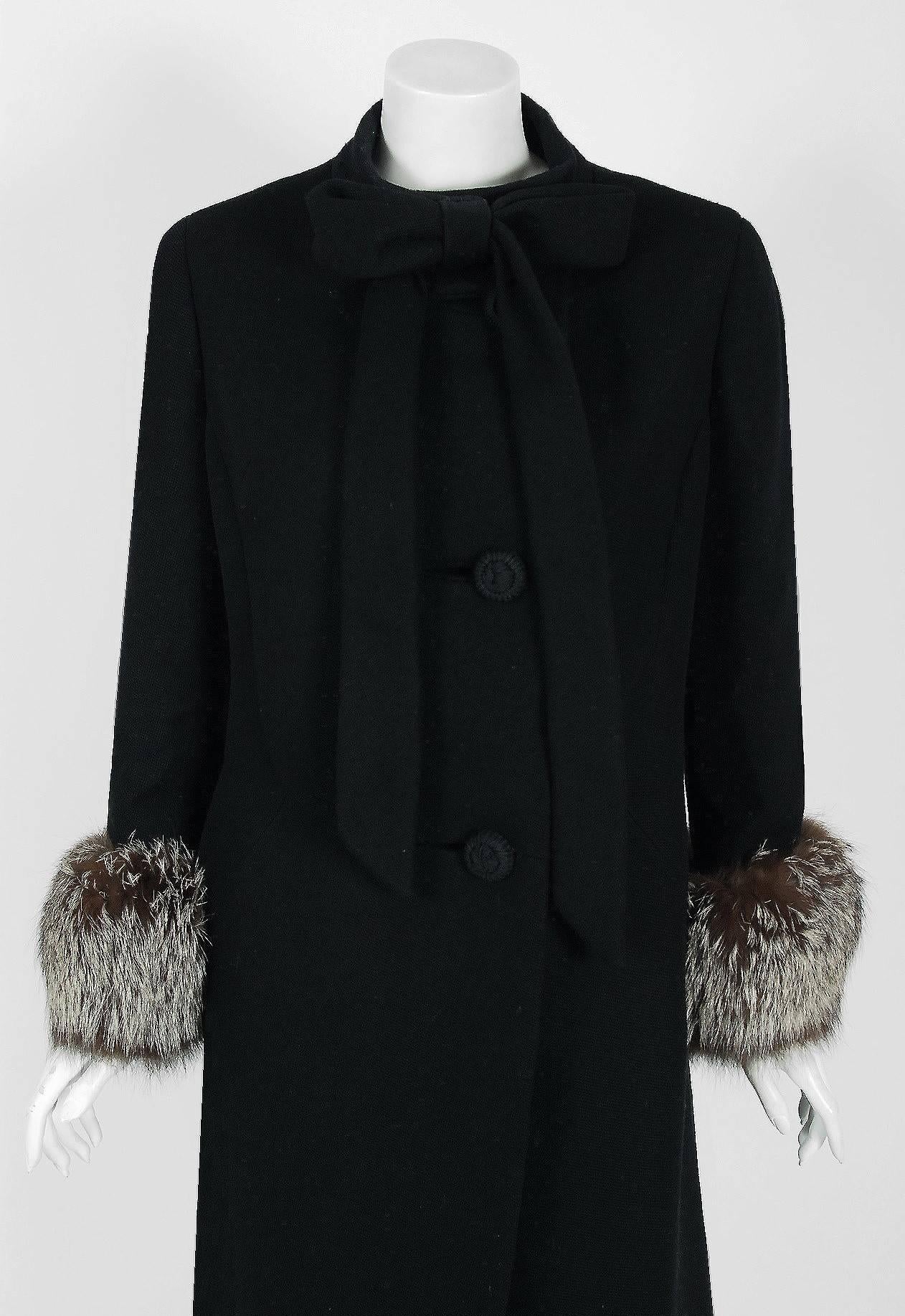 This exquisite Pierre Cardin black woven-wool coat, dating back to his 1965 collection, will make any woman shine during cold months. I adore the bow-tie collar design and dramatic silver-fox fur cuffs! The silhouette is an ultra-flattering a-line