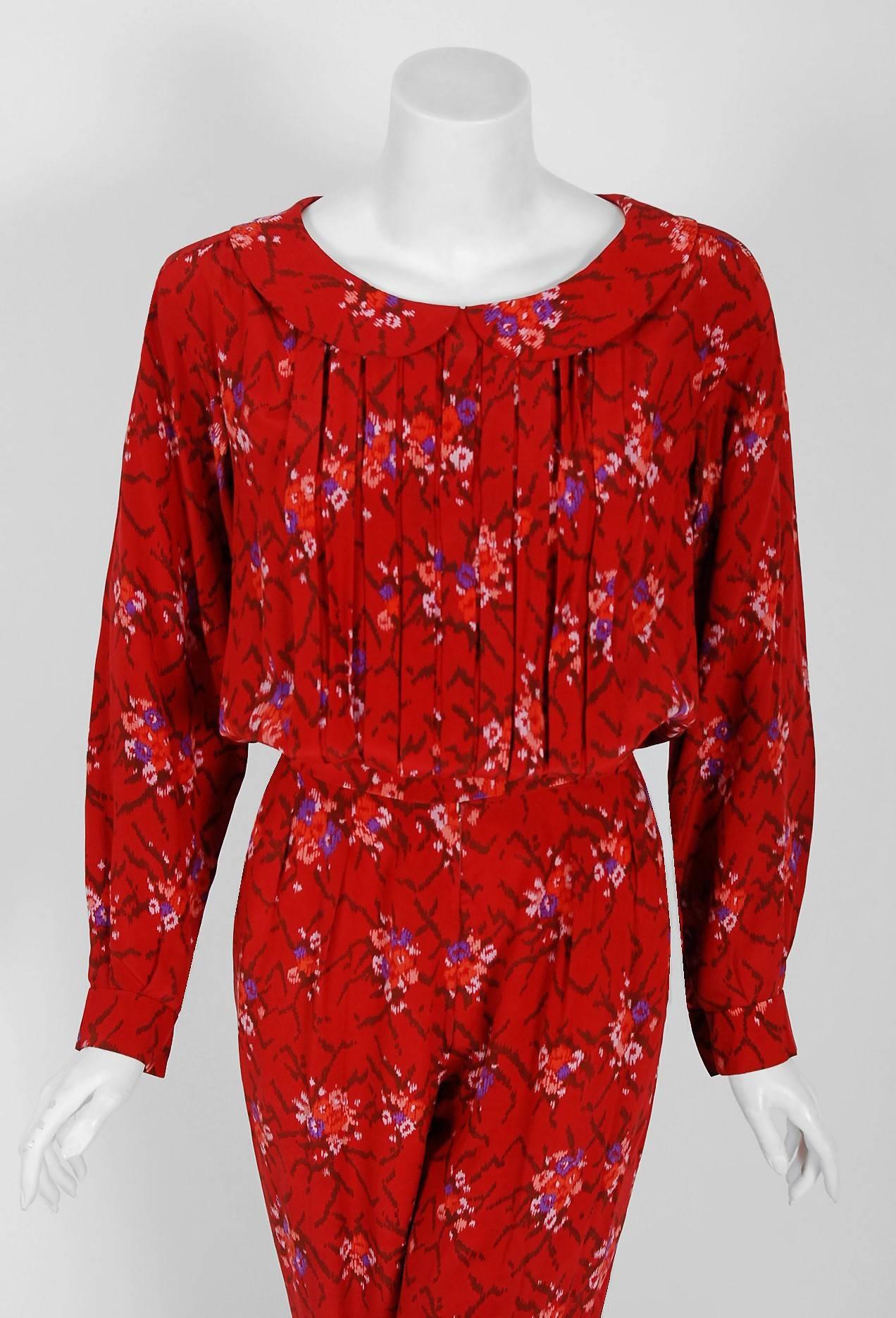 This extremely chic Lanvin treasure, in the most stunning ruby-red graphic floral print, is a statement piece. It manifests liveliness and makes you feel confident. The bodice has a chic peter-pan collar with three-dimensional couture pleating. I