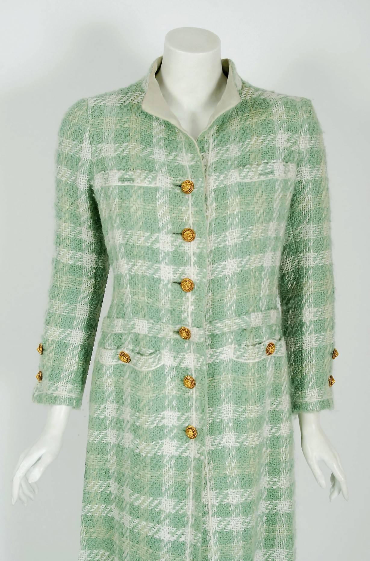Chanel is known to be one of the most luxurious and decadent fashion houses in the world. This breathtaking seafoam green boucle plaid wool coat from her 1970 Spring.Summer collection is a perfect example of why this couture brand has stood the test