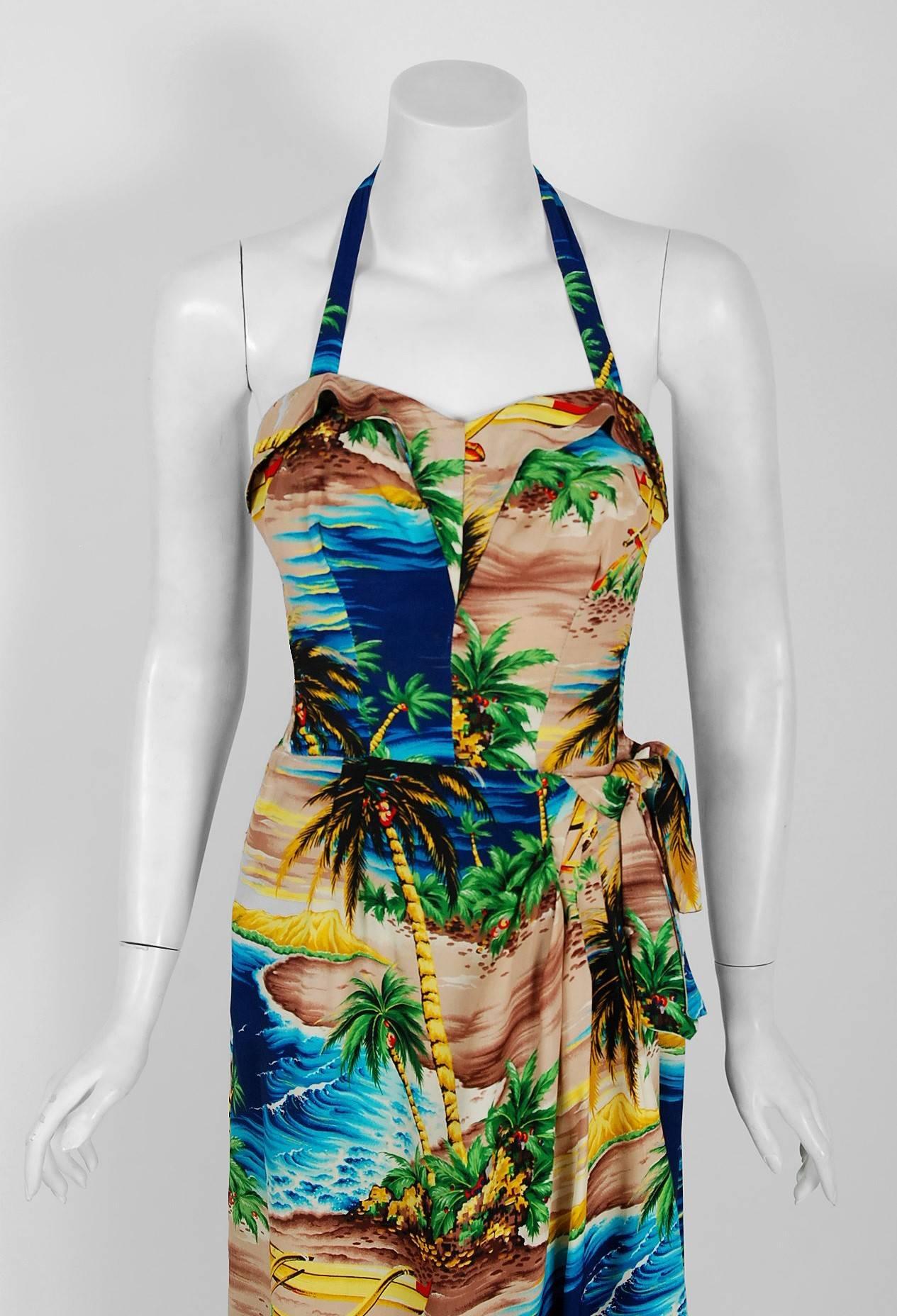 Breathtaking 1940's Hale Hawaii silk sarong ensemble fashioned in a gorgeous and vivid multi-colored tropical ocean scenic print. Just look at those colors! Along side designers such as Alfred Shaheen, this brand pioneered Hawaii's vital garment