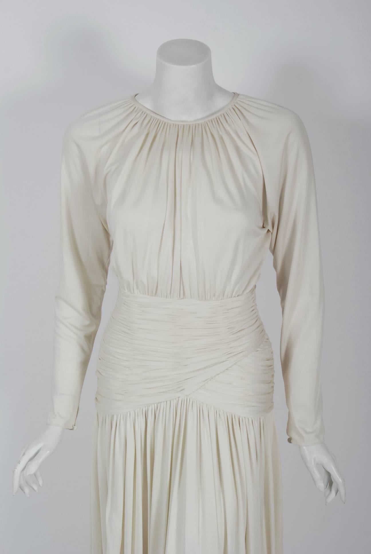 1992 Oscar de la Renta ivory-white goddess gown with original $3300 Saks Fifth Avenue price tags. Oscar de la Renta was one of the world's leading fashion designers. Trained by Cristóbal Balenciaga and Antonio Castillo, he became internationally