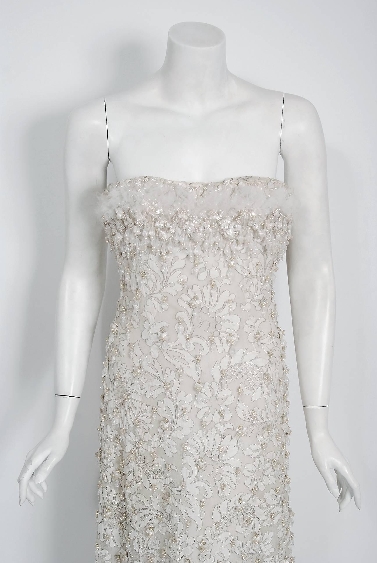 Breathtaking Pierre Balmain Haute Couture ivory metallic embroidered lace gown dating back to his 1965 runway collection. This iconic designer created a very sculptural quality which was always allied with a ladylike essence. His garments have a