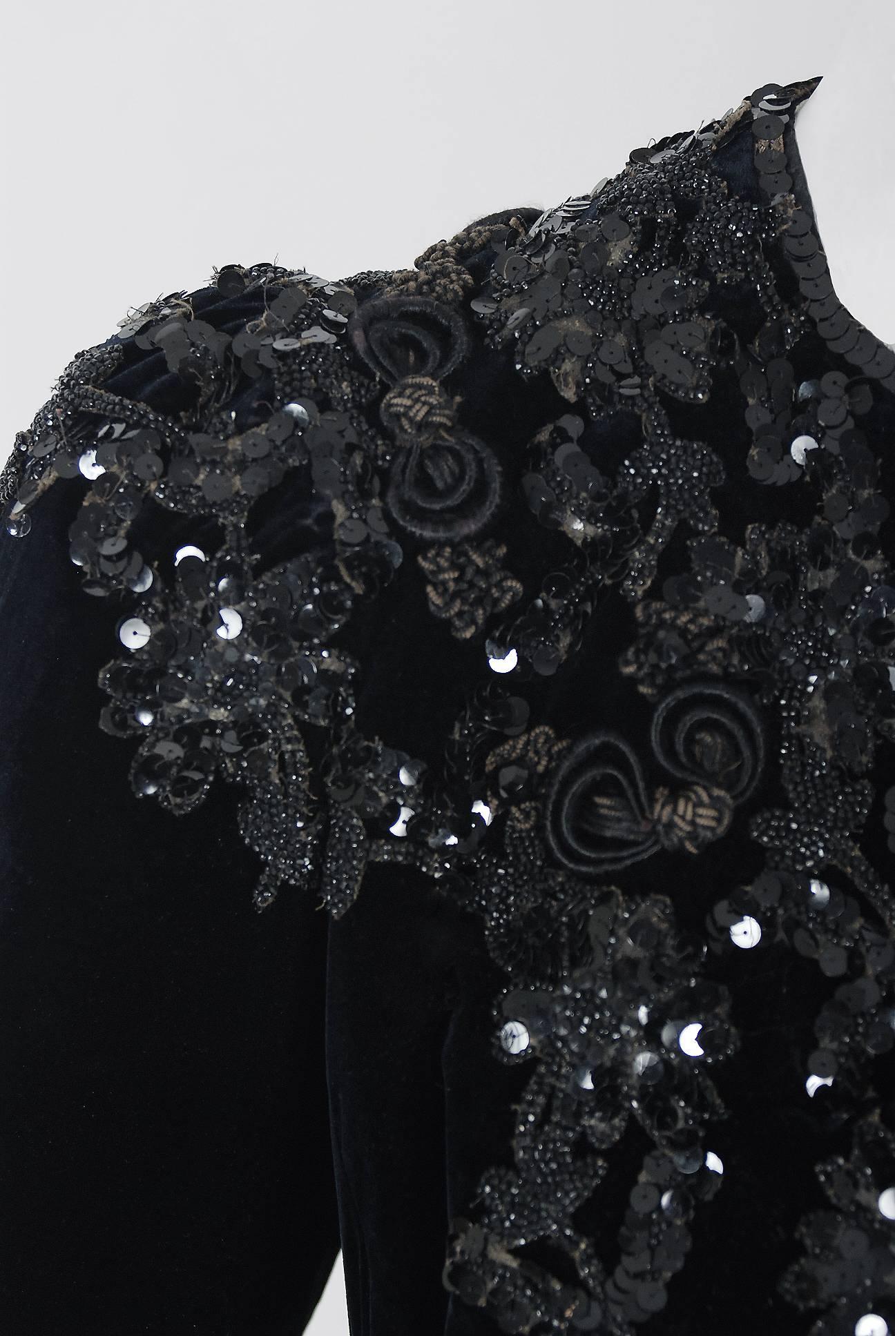 This sensational 1910's Louis Valentin designer couture Edwardian jacket is lavishly embellished with glossy jet-beads and sparkling sequins throughout. The highly stylized applique work perfectly captures the Art Nouveau aesthetic. Luxurious black