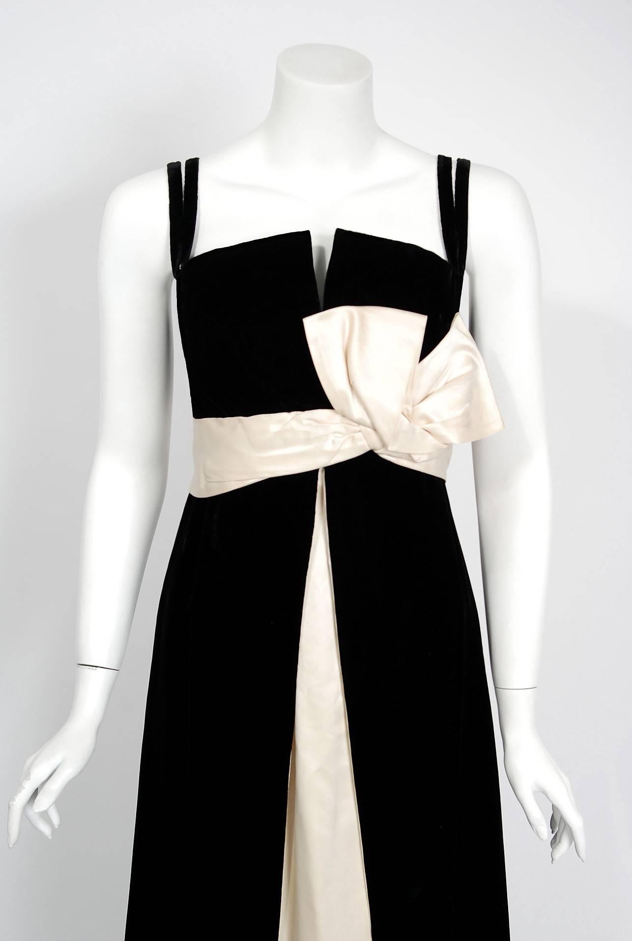 Breathtaking Philip Hulitar couture black velvet and ivory satin evening gown dating back to the late 1950's. Hulitar's brilliance has been known to fashion cognoscenti for years. His work is eagerly sought after by collectors who appreciate
