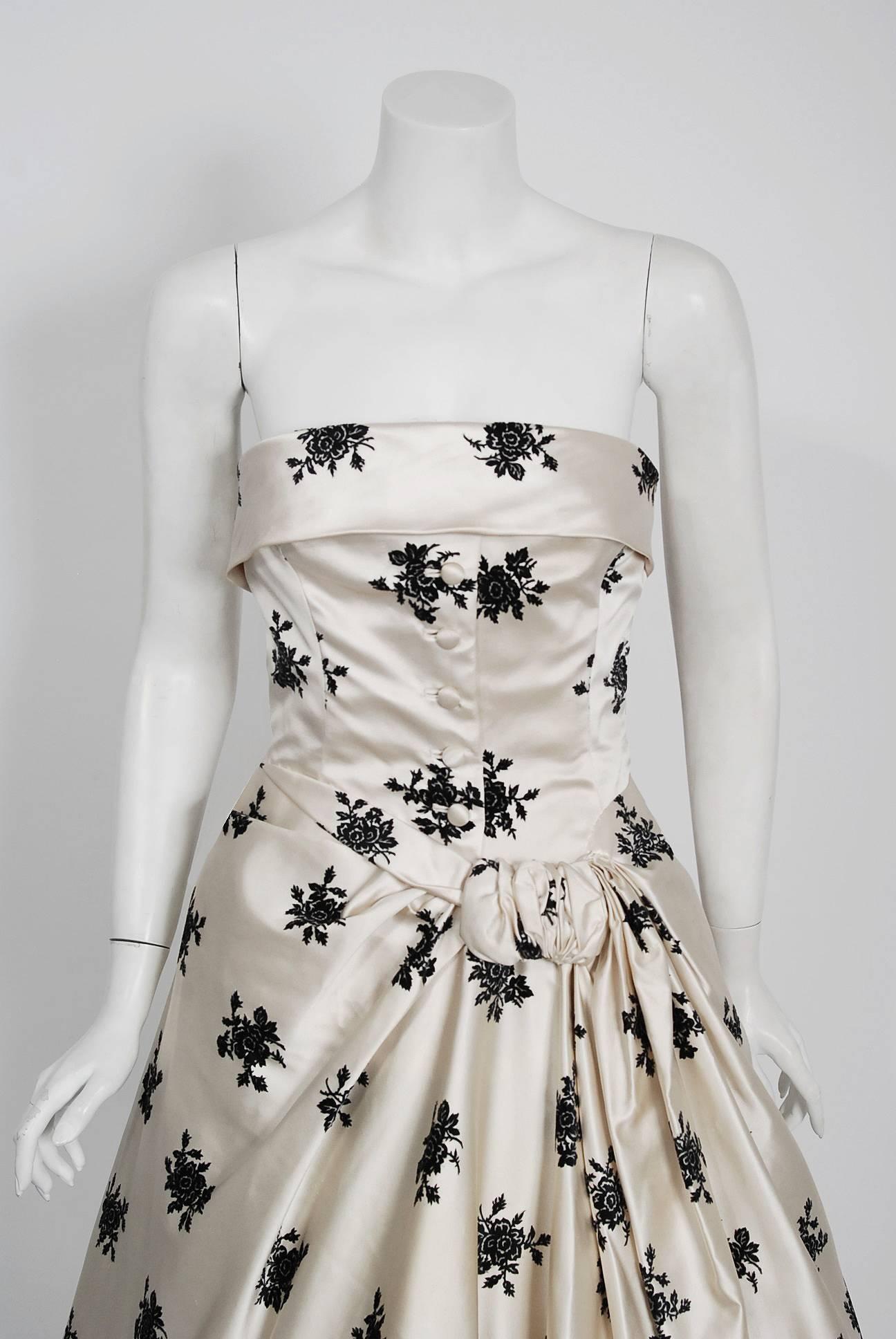 Breathtaking Hattie Carnegie Couture satin party dress dating back to her 1955 collection. The name Hattie Carnegie is very often associated with elegance and high fashion. Carnegie’s fashion philosophy is summed up as "the woman should wear