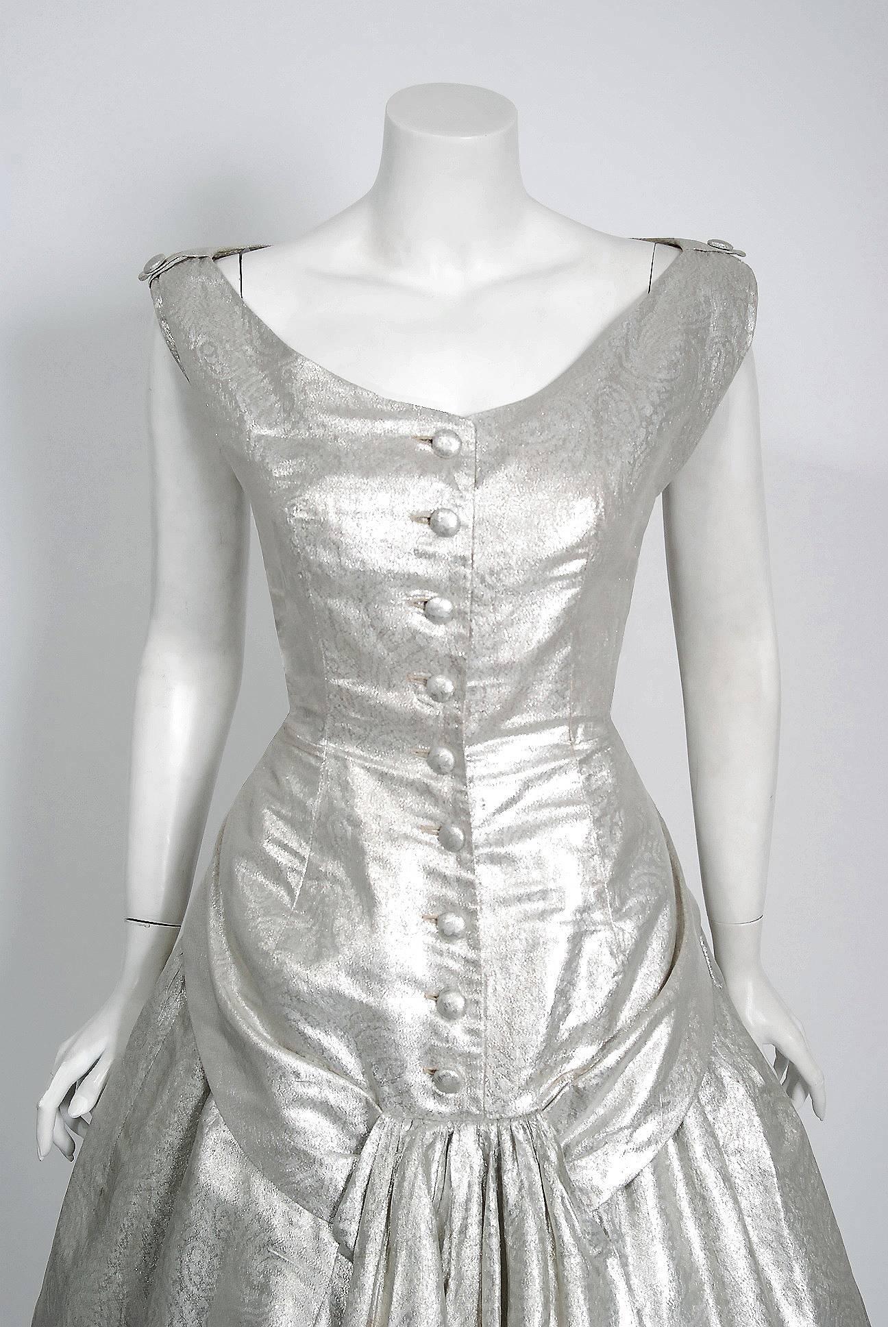 Sparkling Suzy Perette designer metallic silver lamé cocktail party dress dating back to the mid 1950's. Suzy Perette was not an actual person, but the name of a dress manufacturing company that made affordable versions of haute-couture Parisian