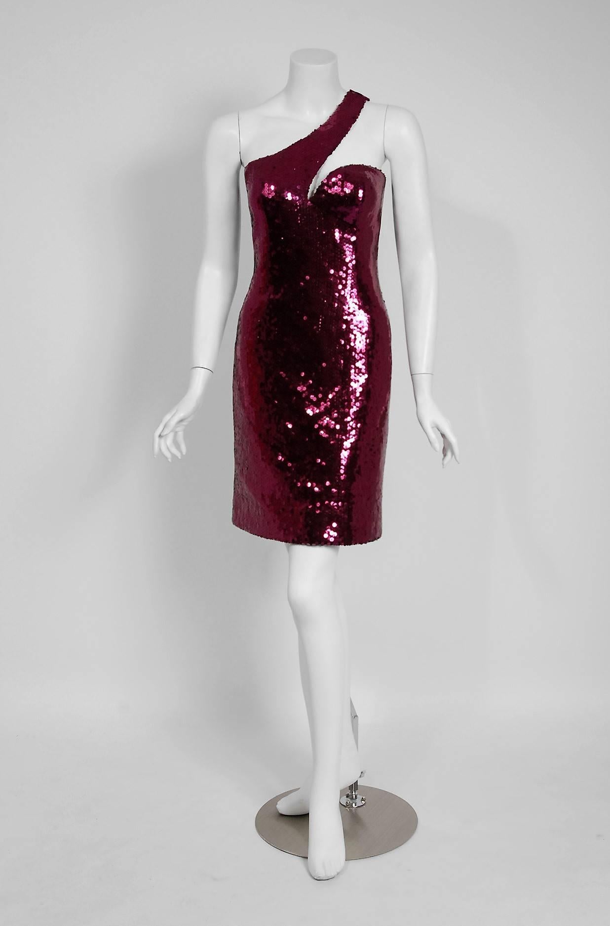 Seductive Loris Azzaro Couture fuchsia-pink sequin showstopper dating back to his 1975 collection. Loris Azzaro was famous for creating glamorous and provocative customized garments for celebrity elite. His timeless designs were favorites to