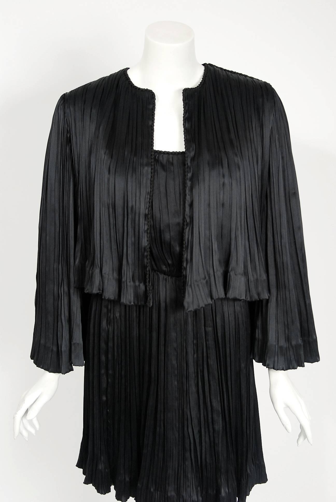 Chanel is known to be one of the most luxurious and decadent fashion houses in the world. This breathtaking black fortuny-pleated silk cocktail dress ensemble from 1977 is a perfect example of why this couture brand has stood the test of time. Not