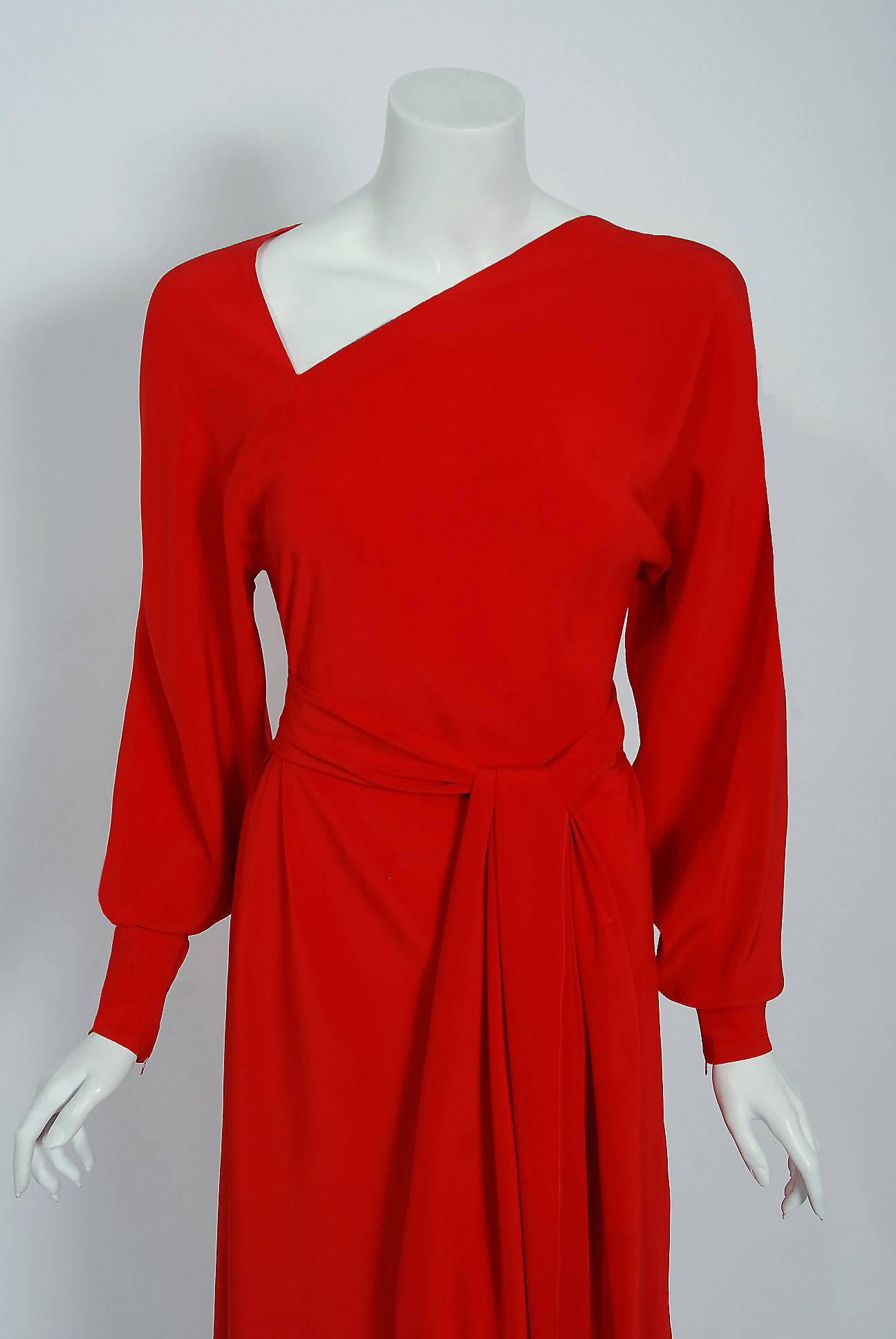 Gorgeous Halston Couture belted dress dating back to his 1977 collection. Throughout most of the seventies he epitomized the glamour, as well as the decadence of the era, becoming a central figure in the nightlife scene of New York's Studio 54. He