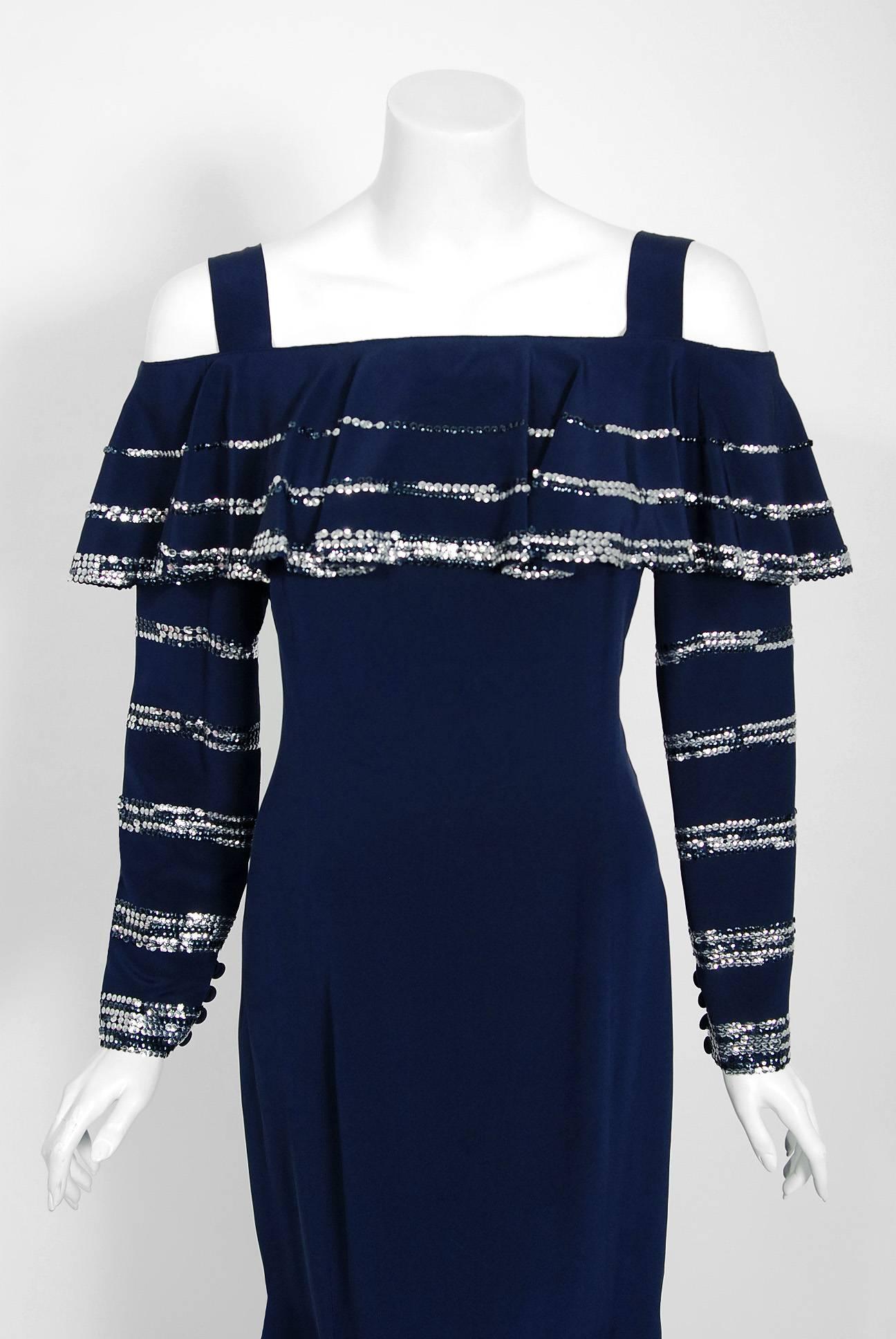 A breathtaking Karl Lagerfeld for Chloe navy-blue silk bohemian glam dress dating back to the mid 1970's. He uses an ingenious ruffle technique which really gives the garment so much depth and texture. The 