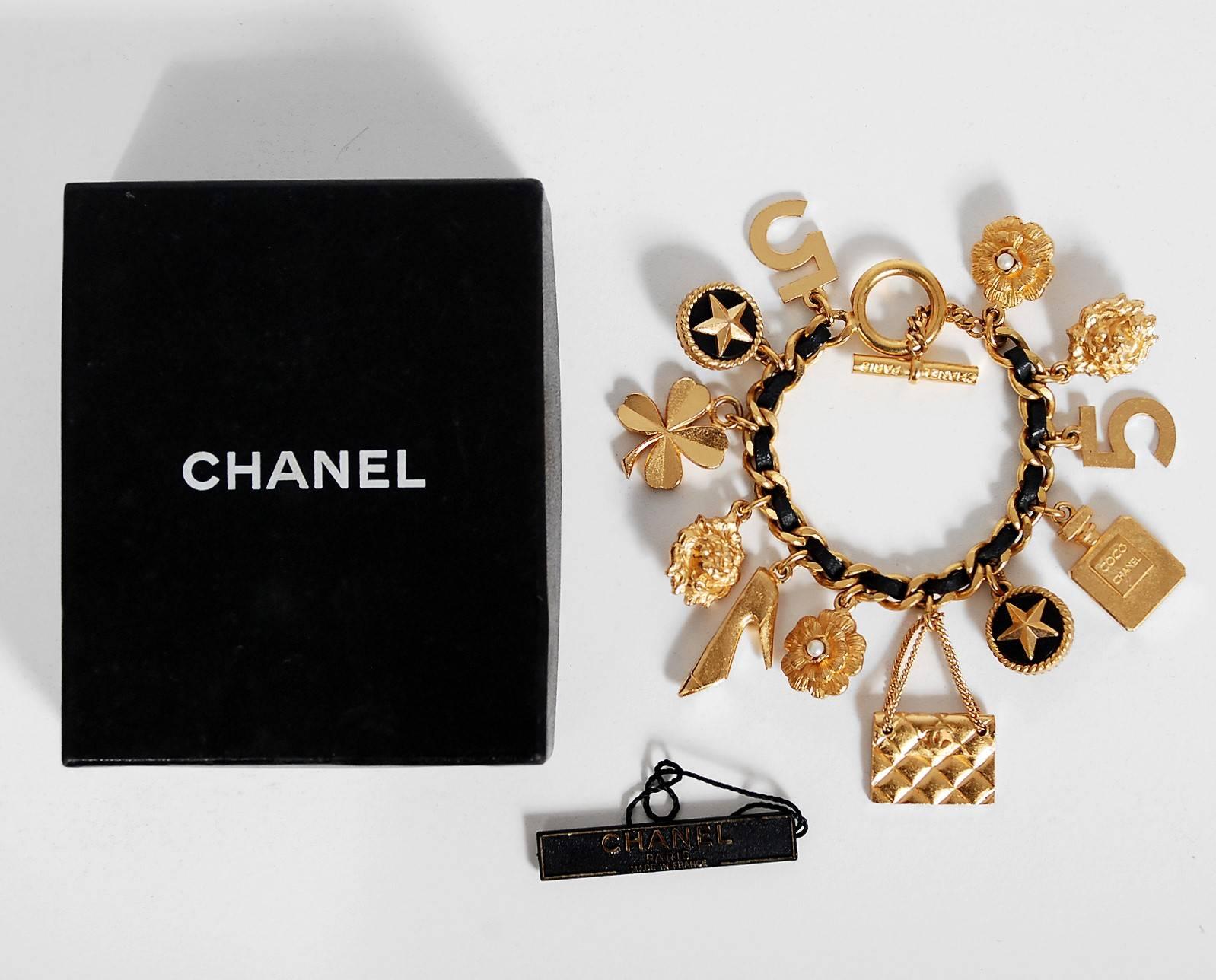 Chanel is known to be one of the most luxurious and decadent fashion houses in the world. This breathtaking gold-toned black woven leather bracelet is a perfect example of why this couture brand has stood the test of time. Selection of charms
