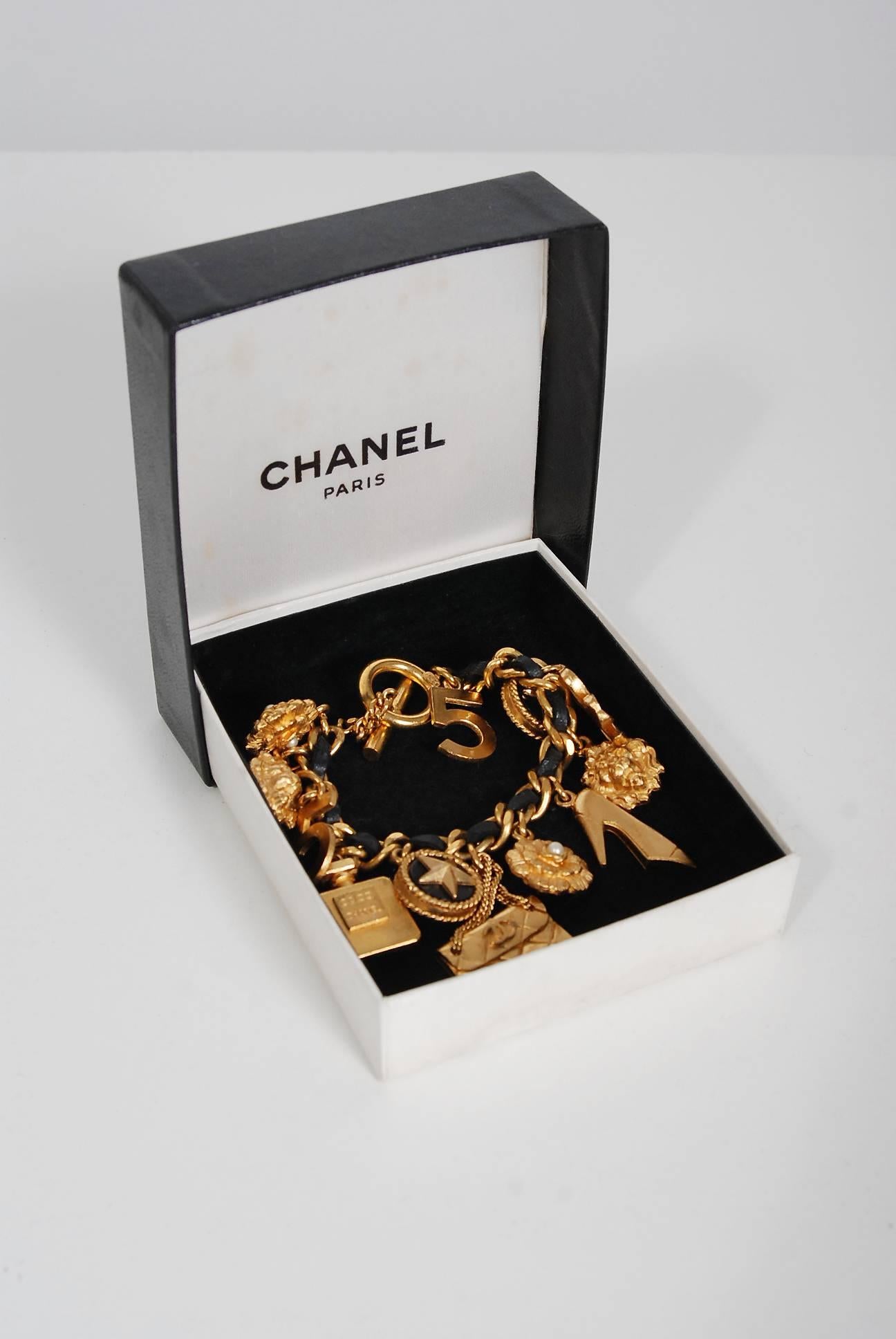 1995 Chanel Gold and Black Woven Leather Novelty Logo Medallion Charm Bracelet In Excellent Condition In Beverly Hills, CA
