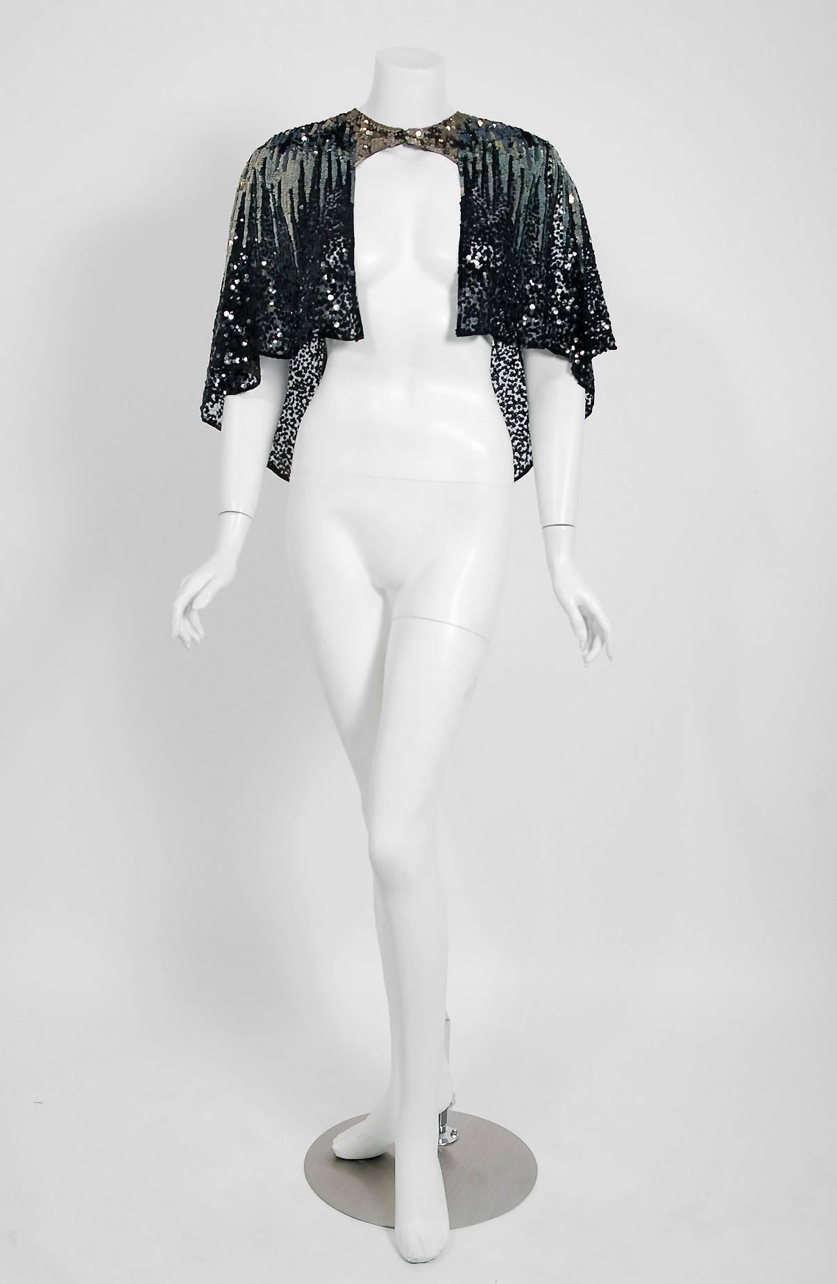 Breathtaking French Couture deco starburst motif sequin net-tulle capelet dating back to the mid 1920's. Evening capes from the Art-Deco era remain a perennial favorite, perhaps because no other period combined such opulence with youthful sass. The