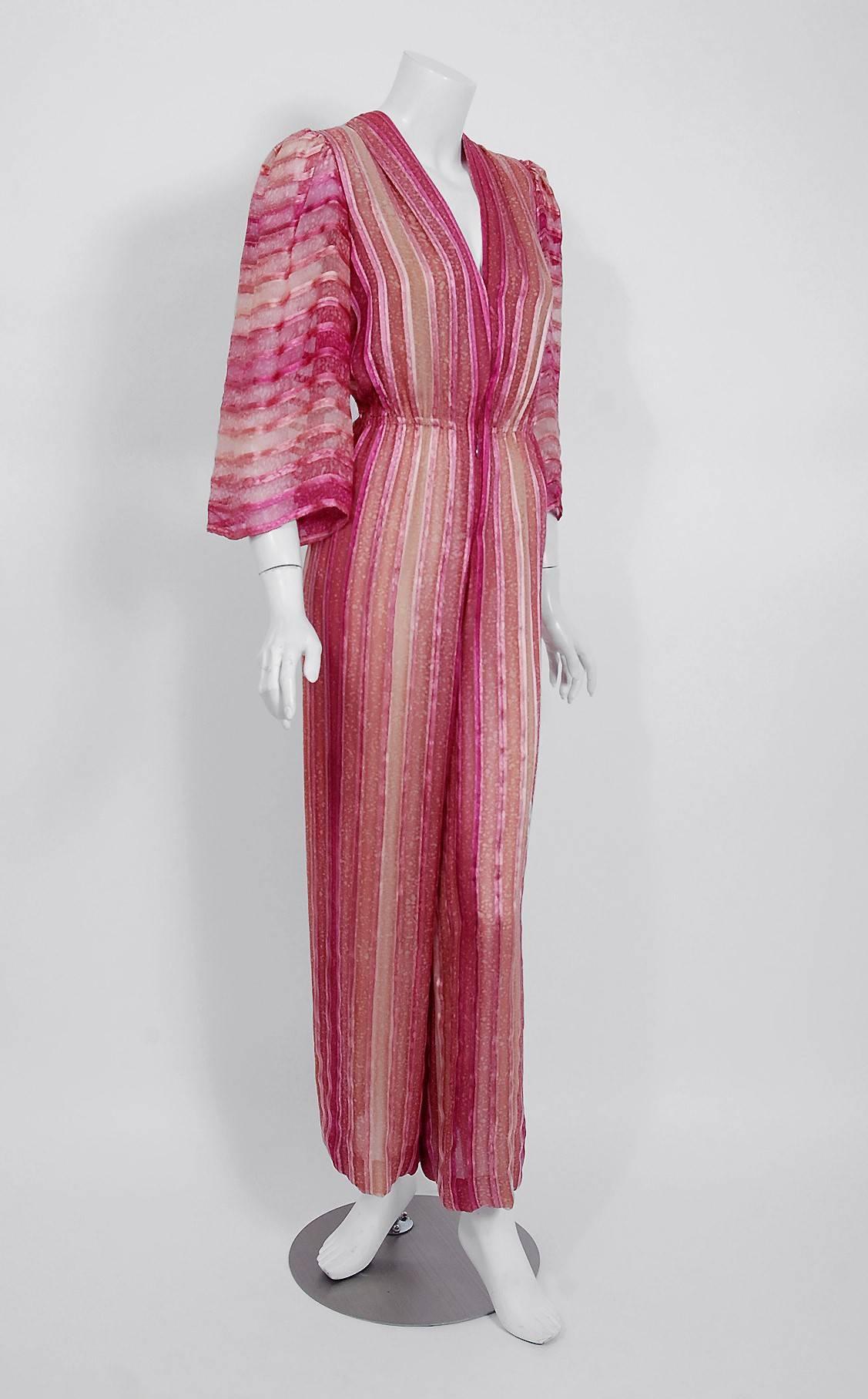 Breathtaking Pauline Trigère designer rose-pink silk jumpsuit dating back to the mid 1970's. During this time period, Trigère's name was part of the glamorous excess in Hollywood fashion. Her exquisite tailoring and feminine fitting clothing were