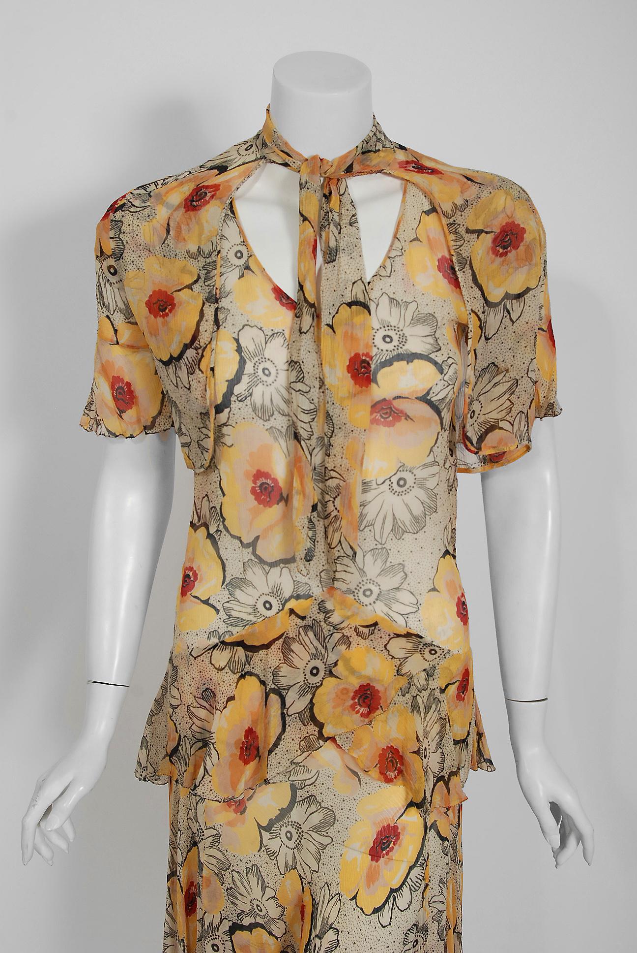 The breathtaking large-scale watercolor marigold poppy floral print used for this early 1930's crepe chiffon ensemble has a fresh innocence that I find irresistible. The bodice has an elegant short-sleeve plunge with bias-cut shaping. The matching